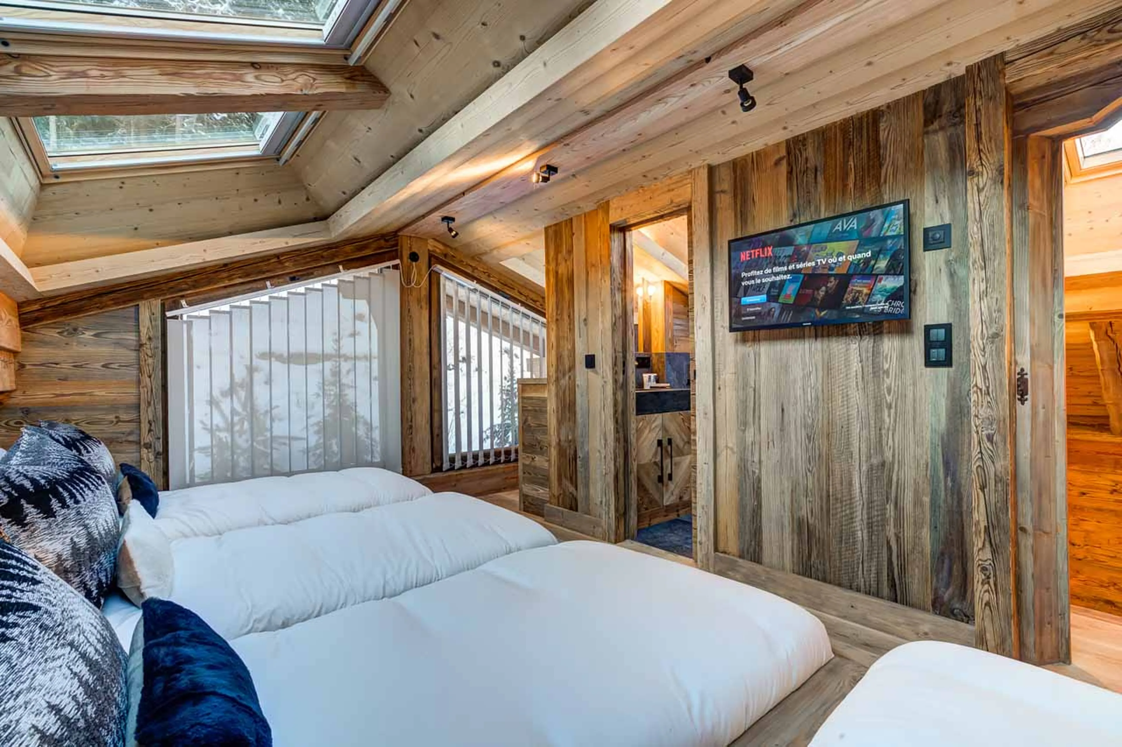 TV in mezzanine bedroom at Chalet Azurite in Chamonix
