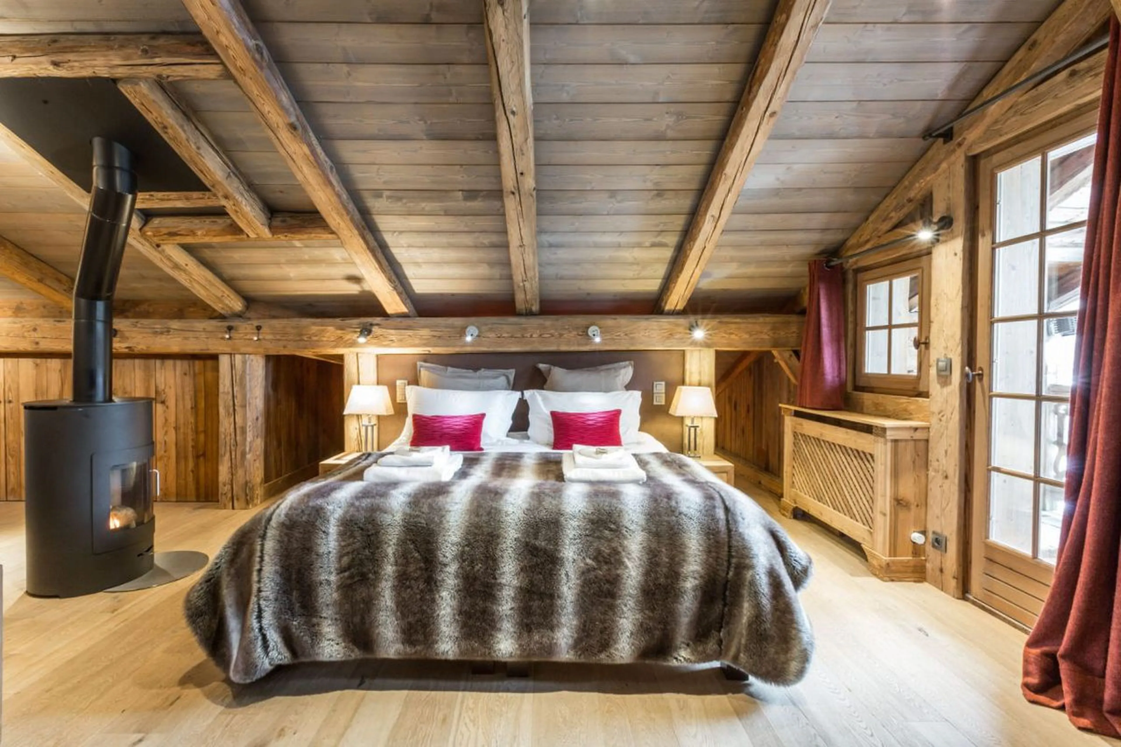 King-size bed in master bedroom of Chalet Baloo in Chamonix