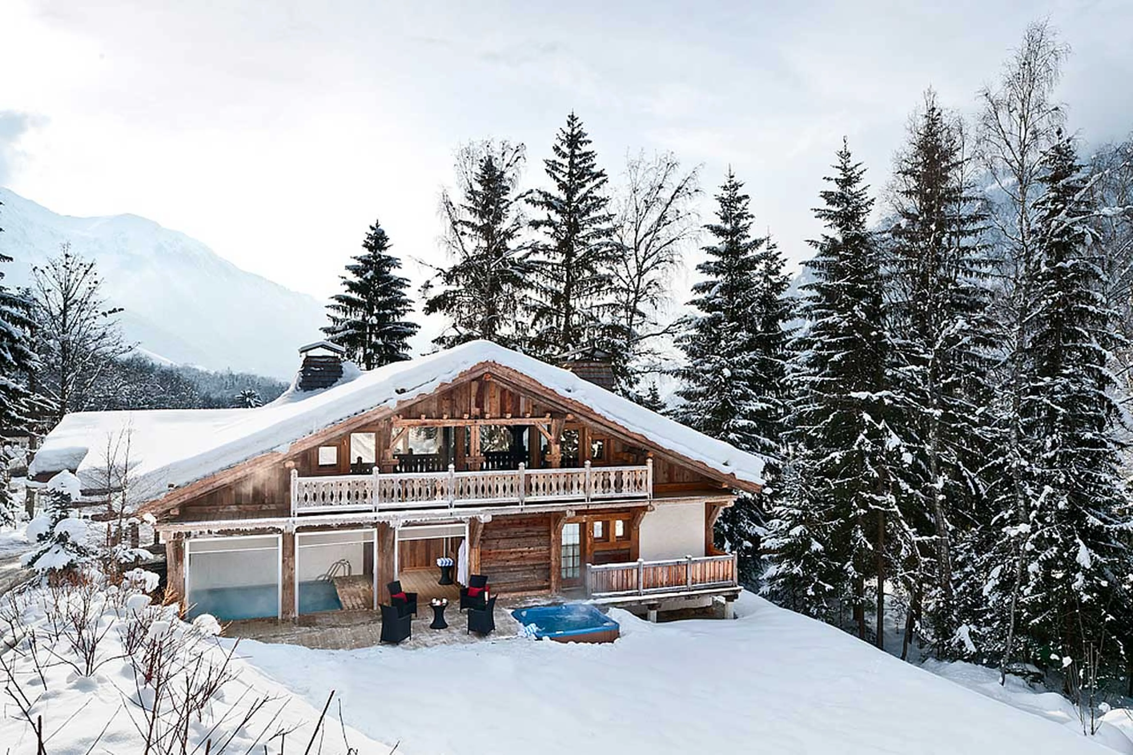 Exterior of Chalet Baloo in Chamonix in winter, surrounded by woodland