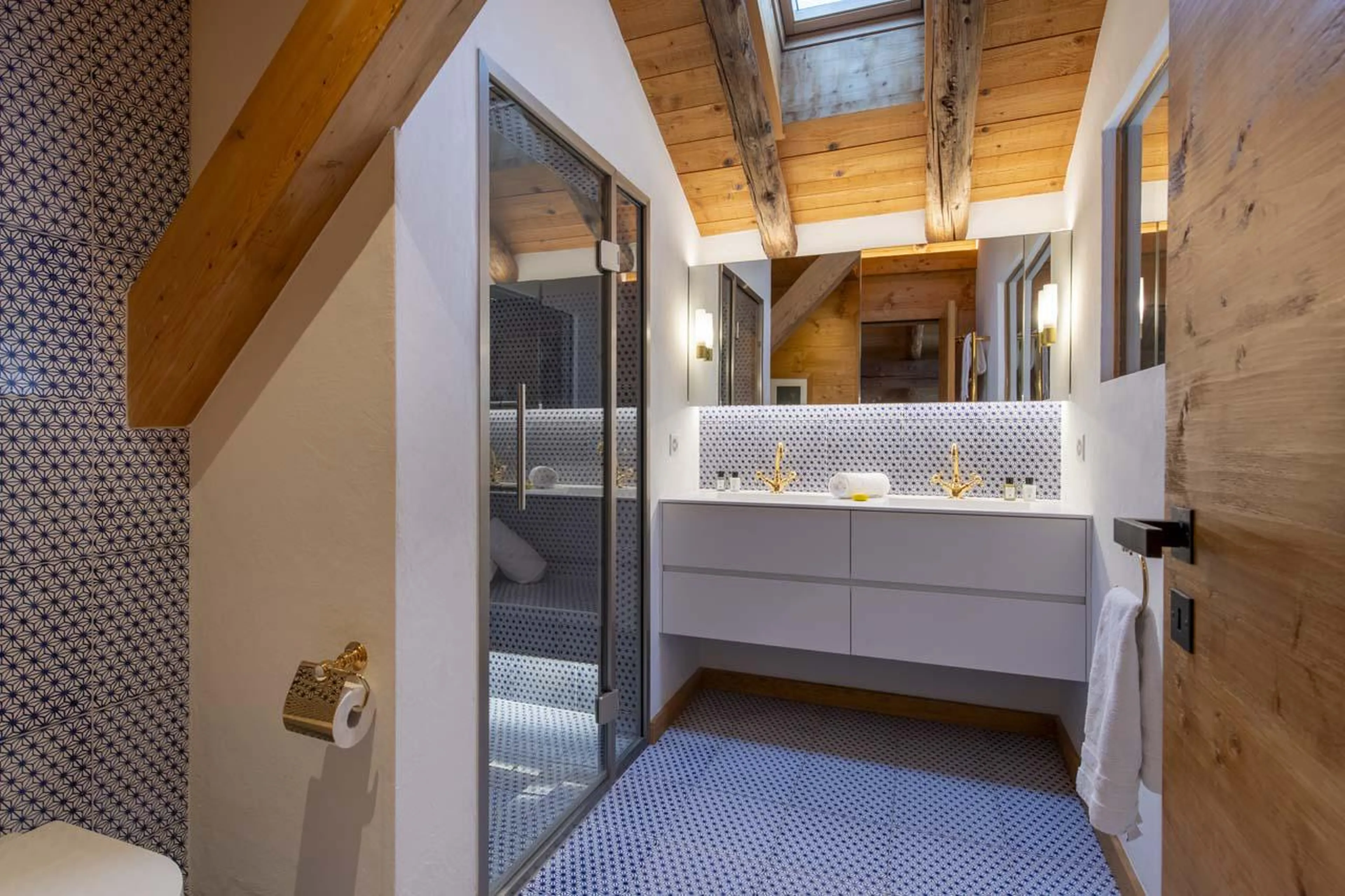 En-suite shower room with large hammam shower and double basin at Chalet Bavaria in Verbier