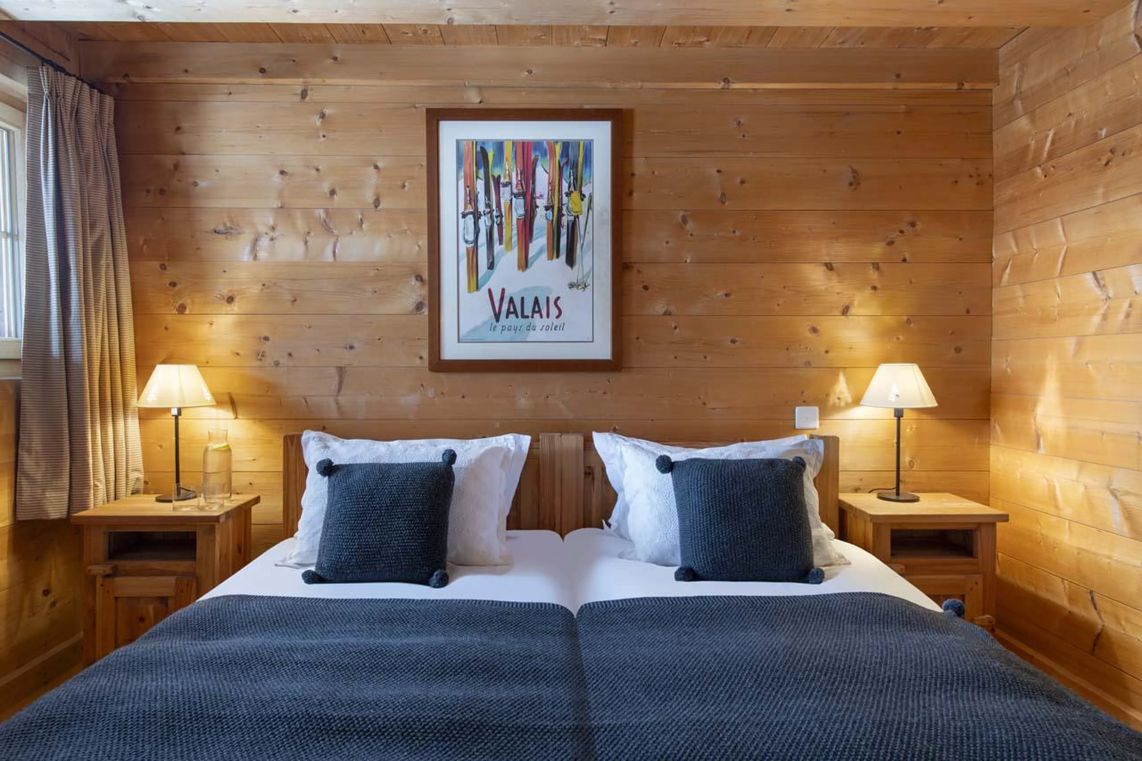 Bedroom with traditional chalet feel at Chalet Bavaria in Verbier