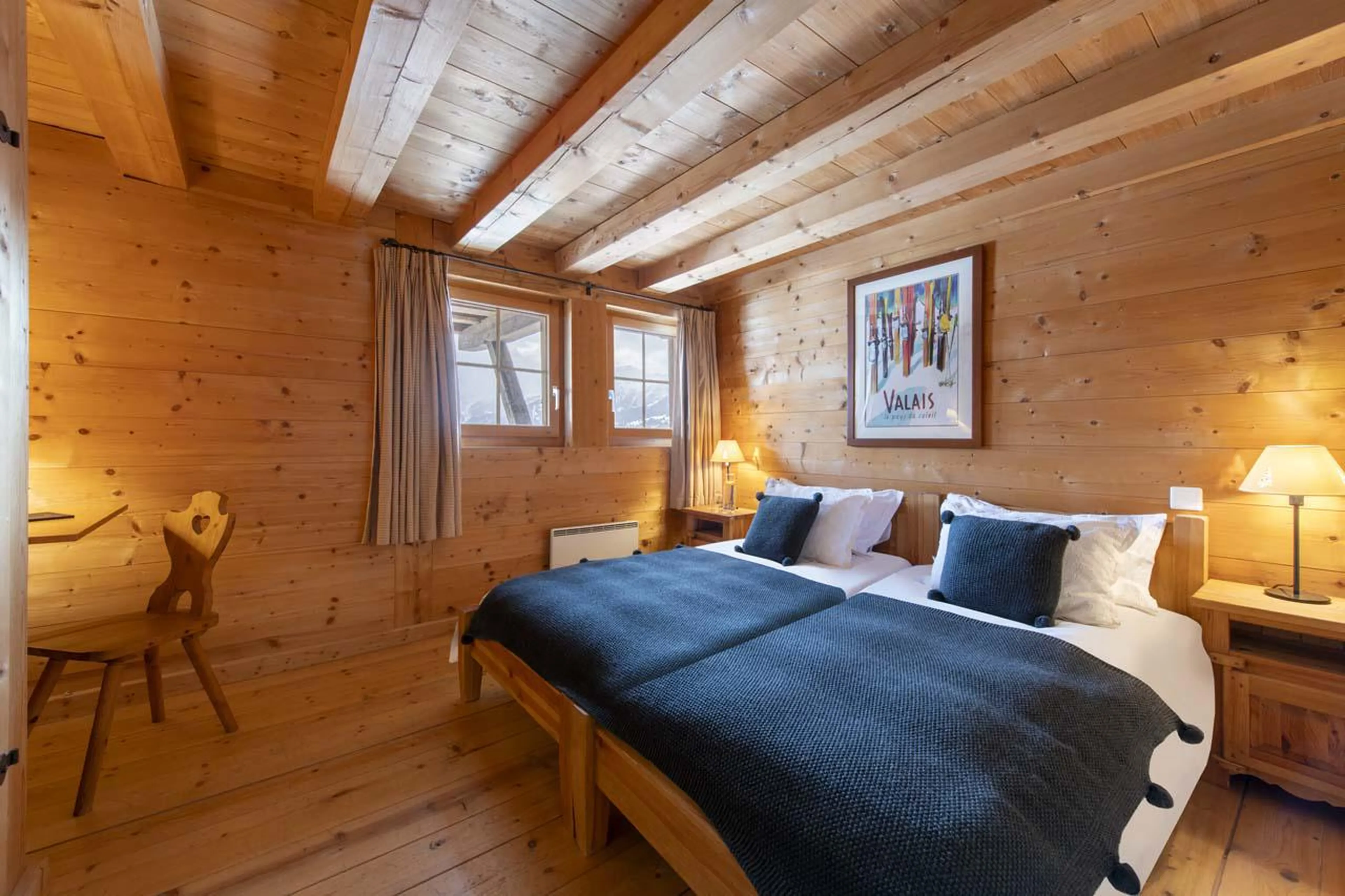 Twin bedroom with separate shower room at Chalet Bavaria in Verbier