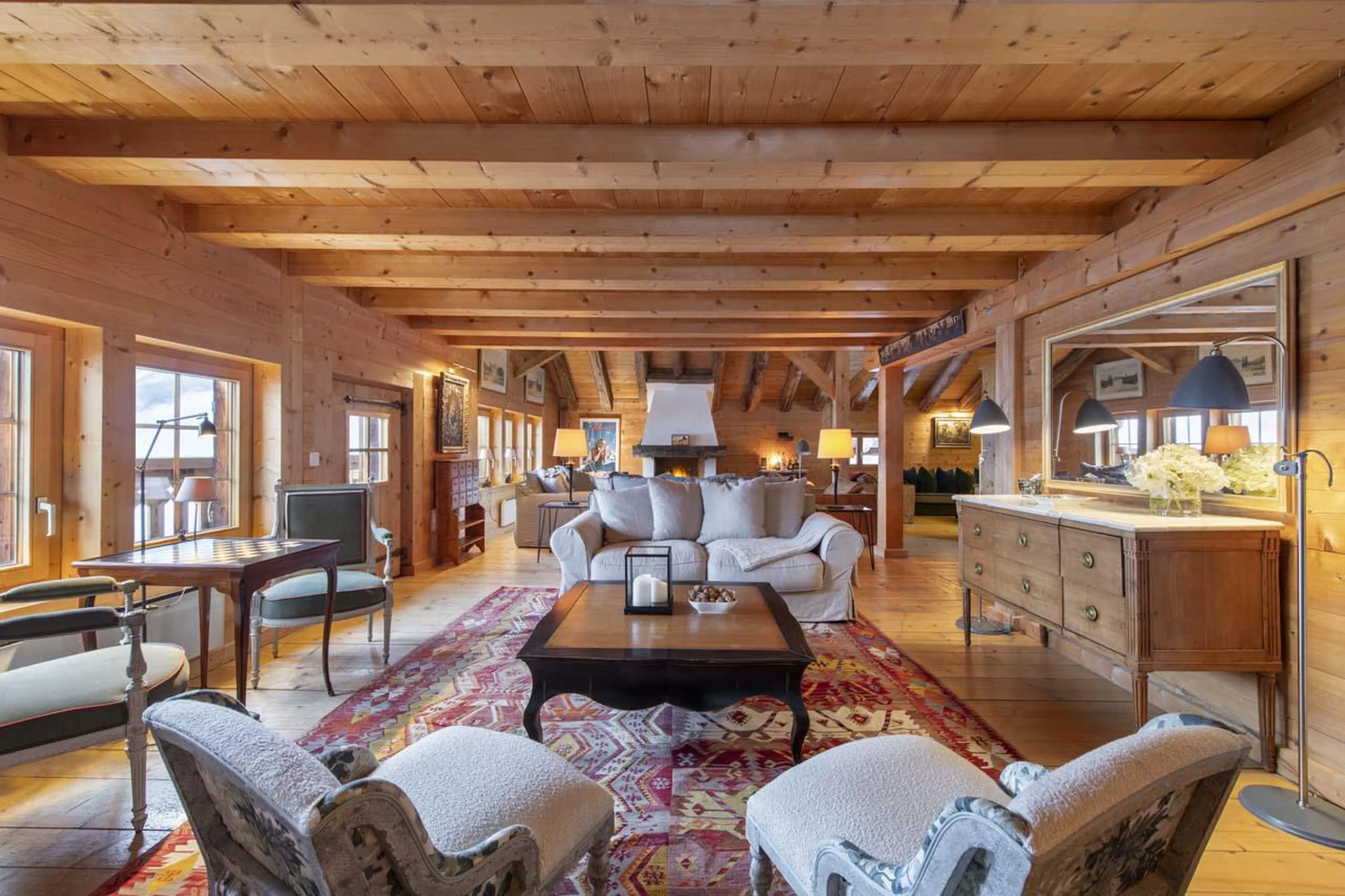 Living space with discreet door offering access to south-facing balcony at Chalet Bavaria in Verbier
