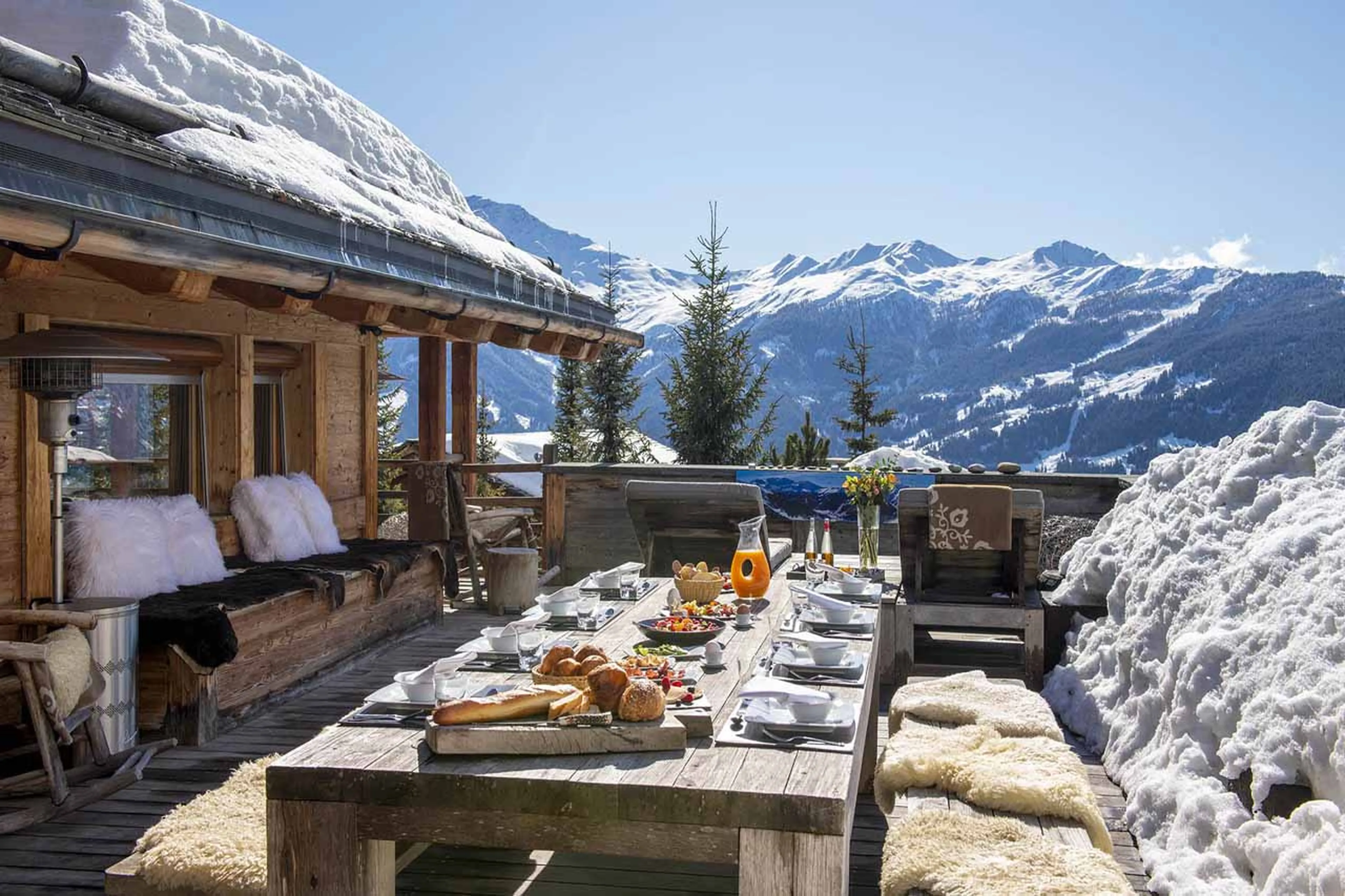 Outdoor dining on terrace at Chalet Belle Claire in Verbier