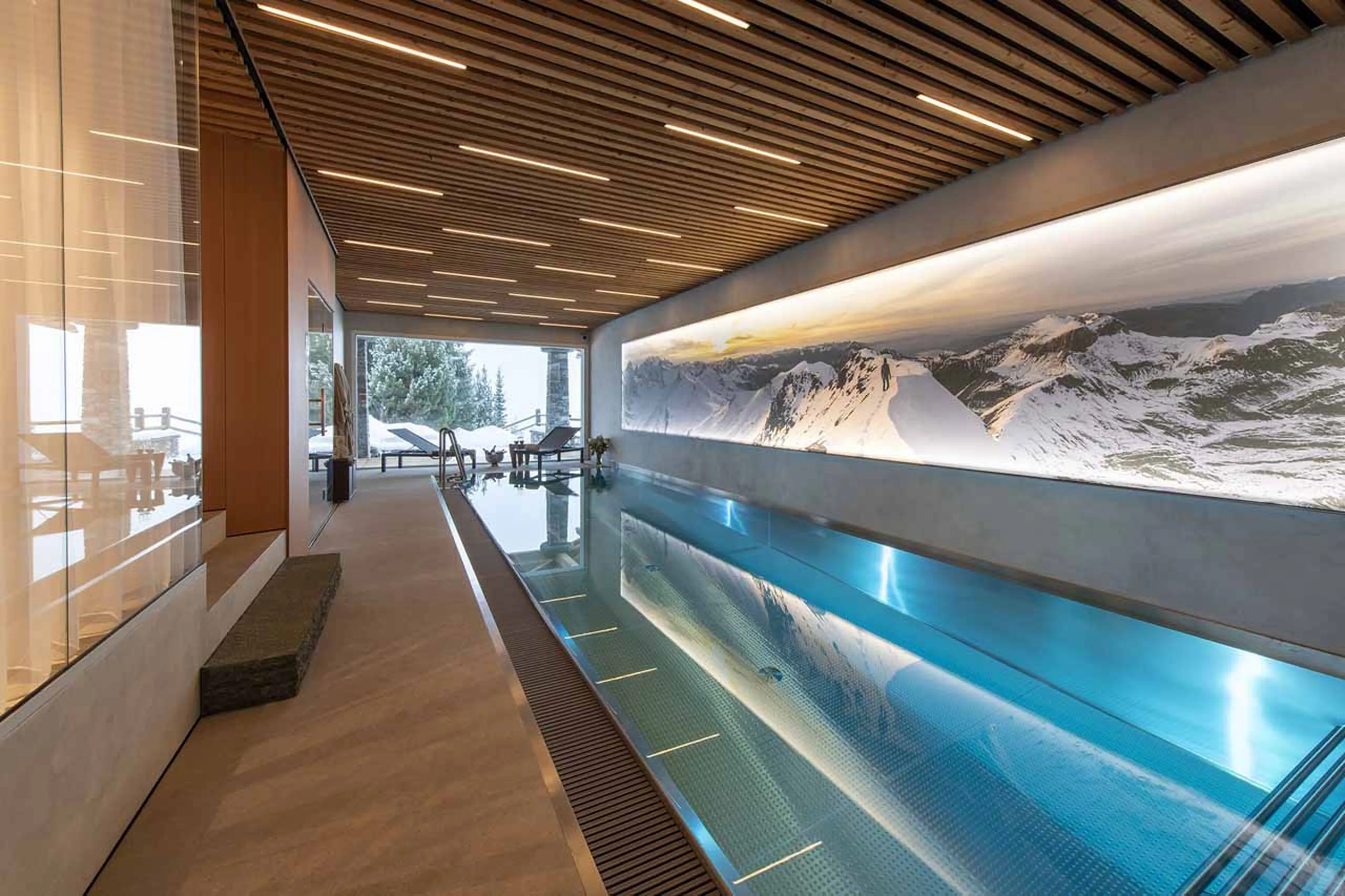 Indoor pool with access to terrace at Chalet Belle Claire in Verbier