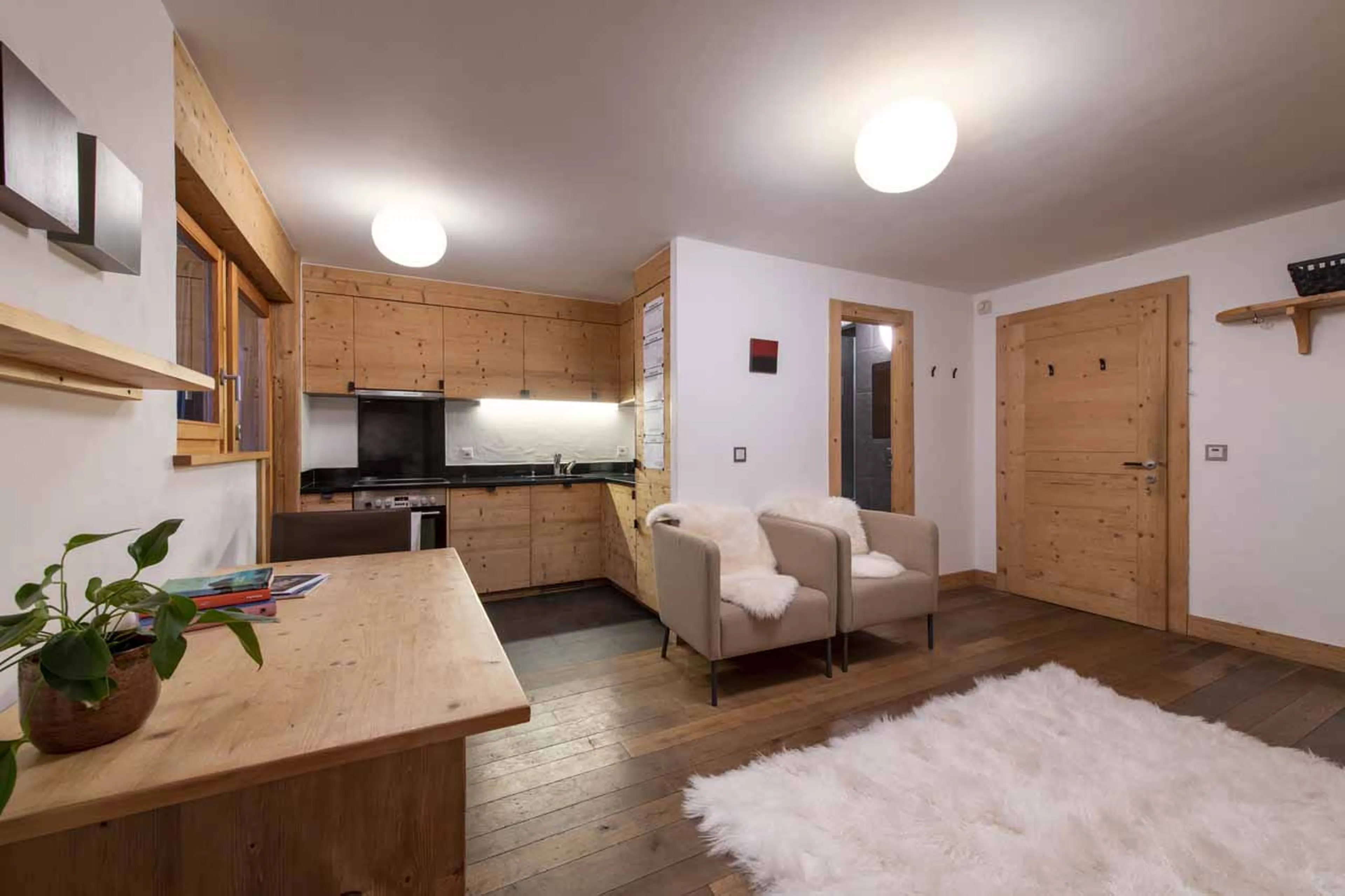 Open plan living area in studio of Chalet Belle Claire in Verbier