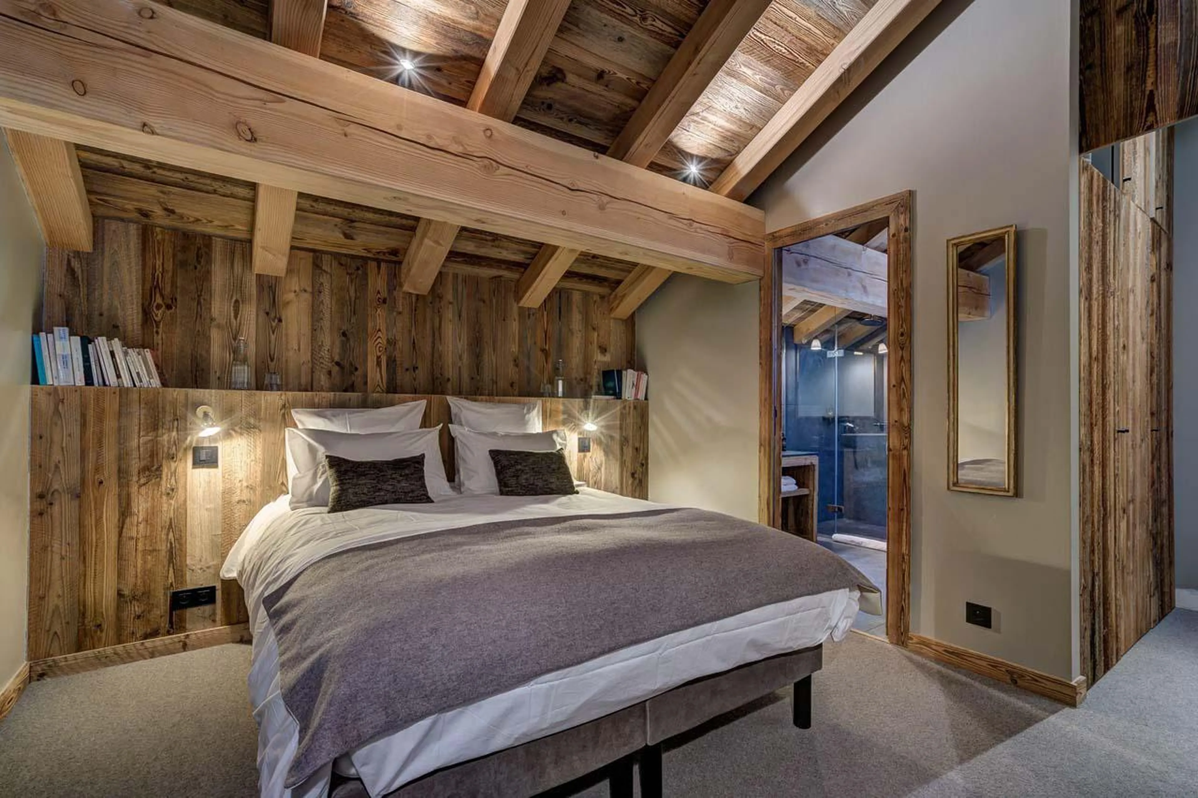 Double/twin bedroom with wooden beamed ceiling at Chalet Bergeronnette in Meribel