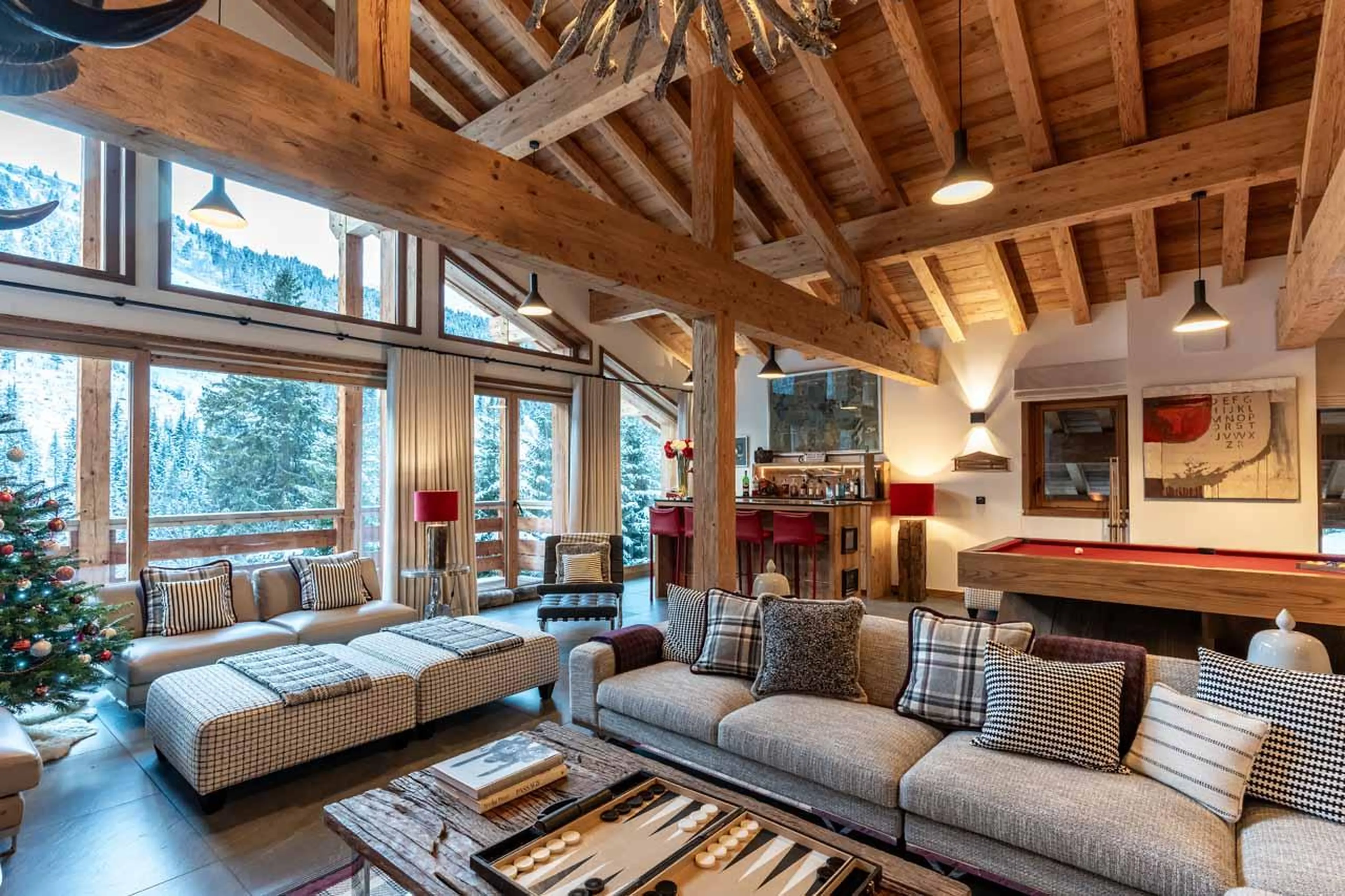 Living area with floor-to-ceiling windows at Chalet Berlioz in Meribel