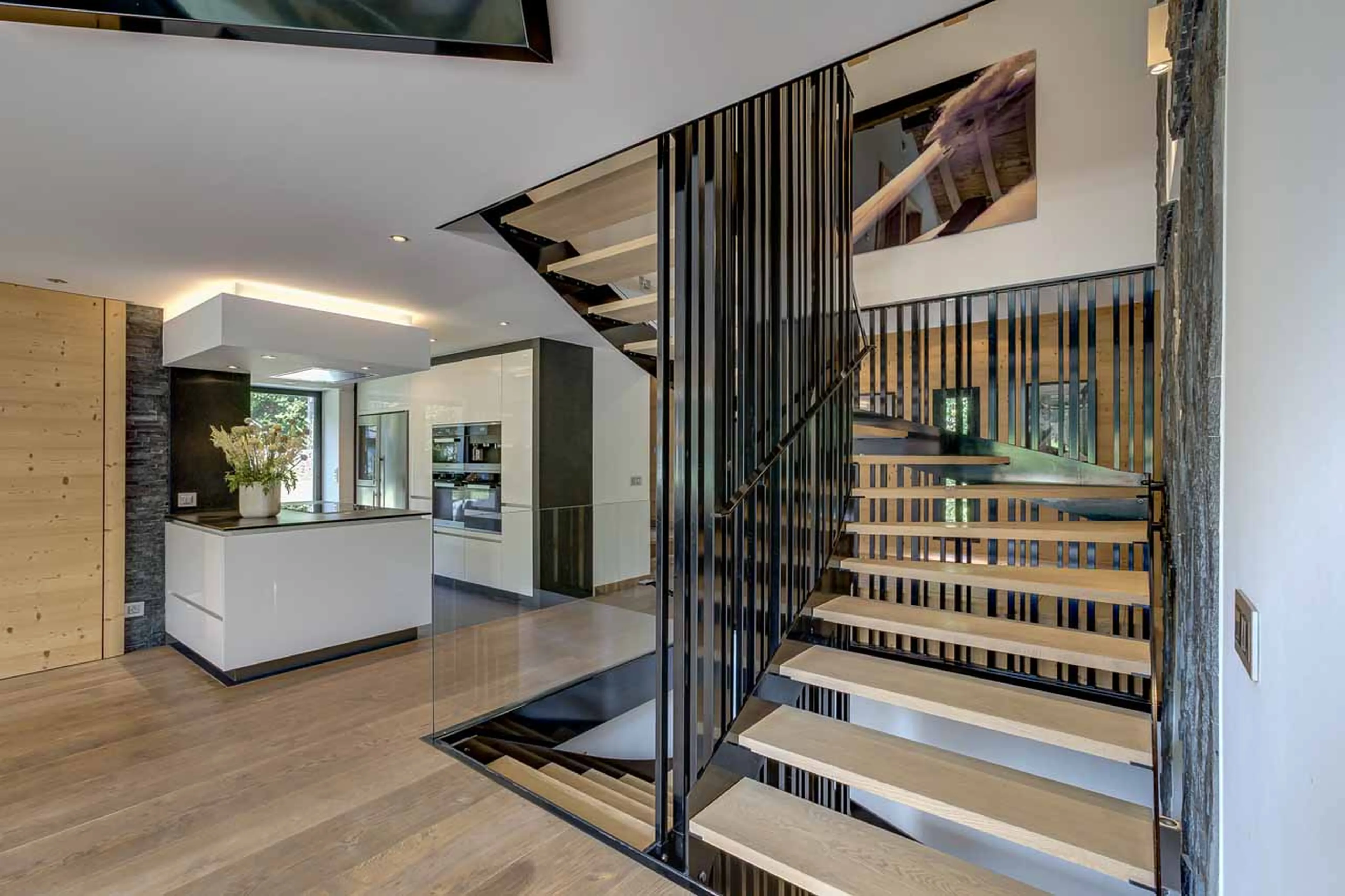 Staircase and kitchen at Chalet Black Diamond in Chamonix