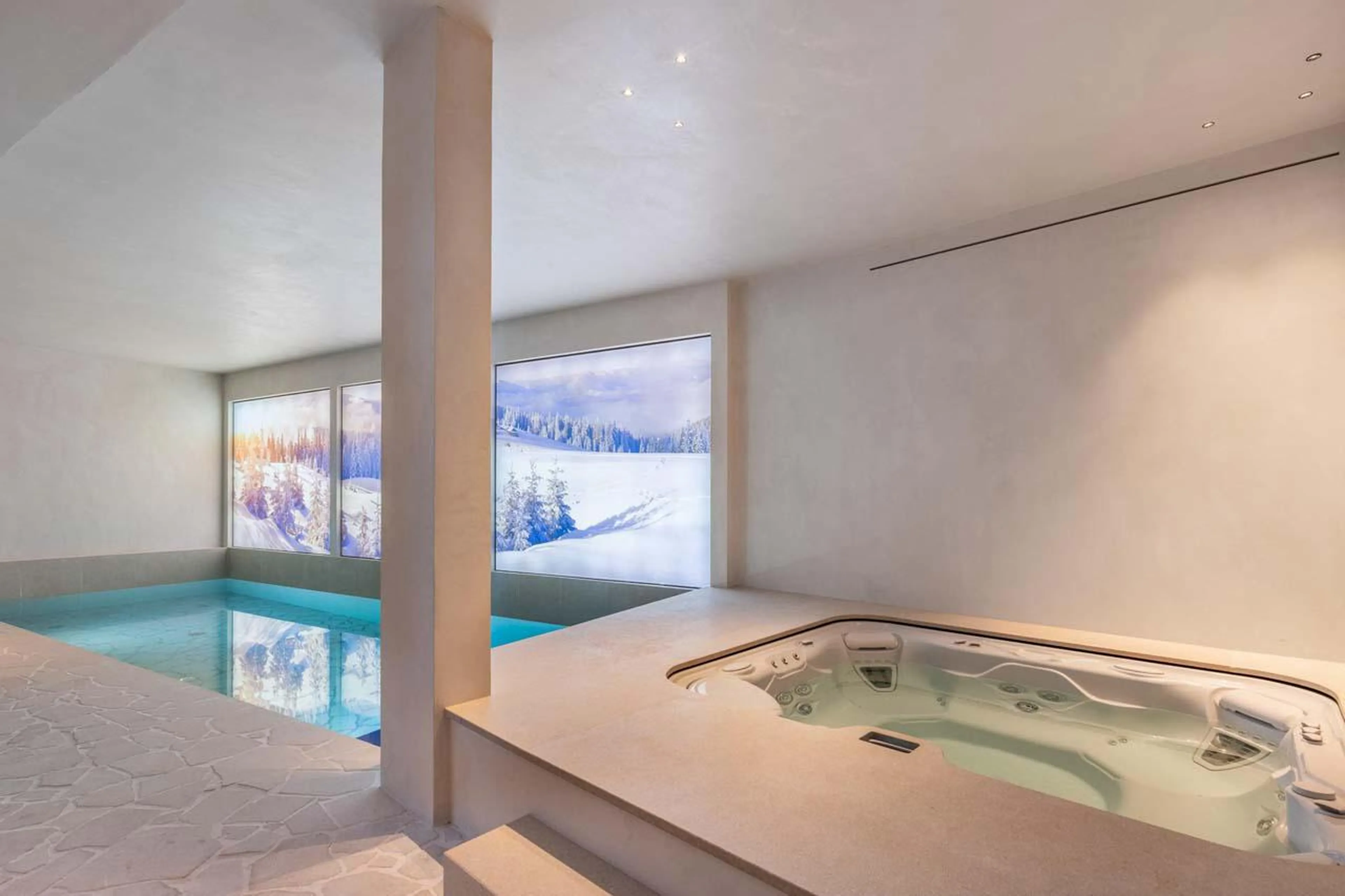 Swimming pool and hot tub at Chalet Black Lodge in Courchevel 1850