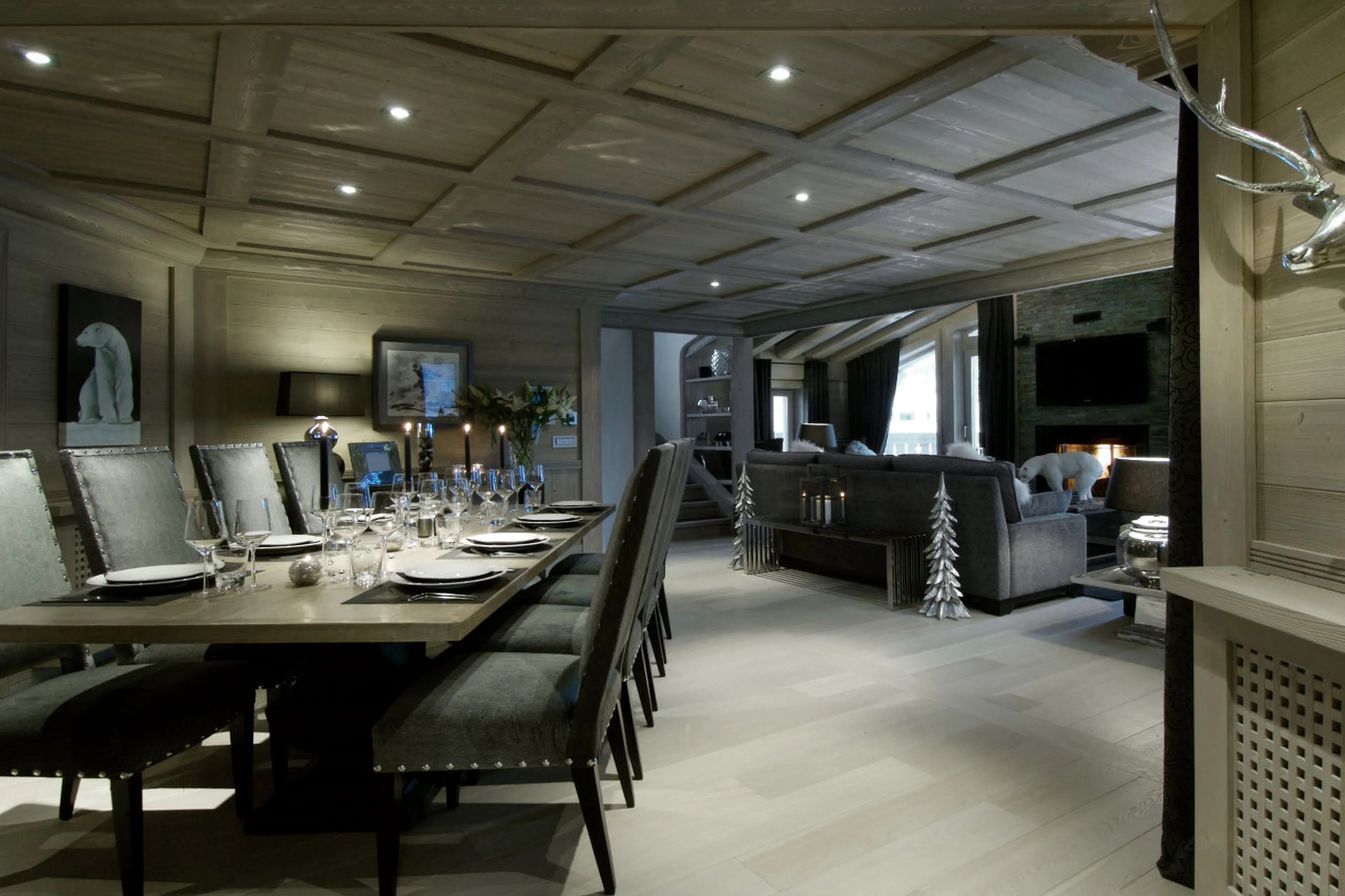Dining table in open plan living area of Chalet Black Pearl in Val d’Isere