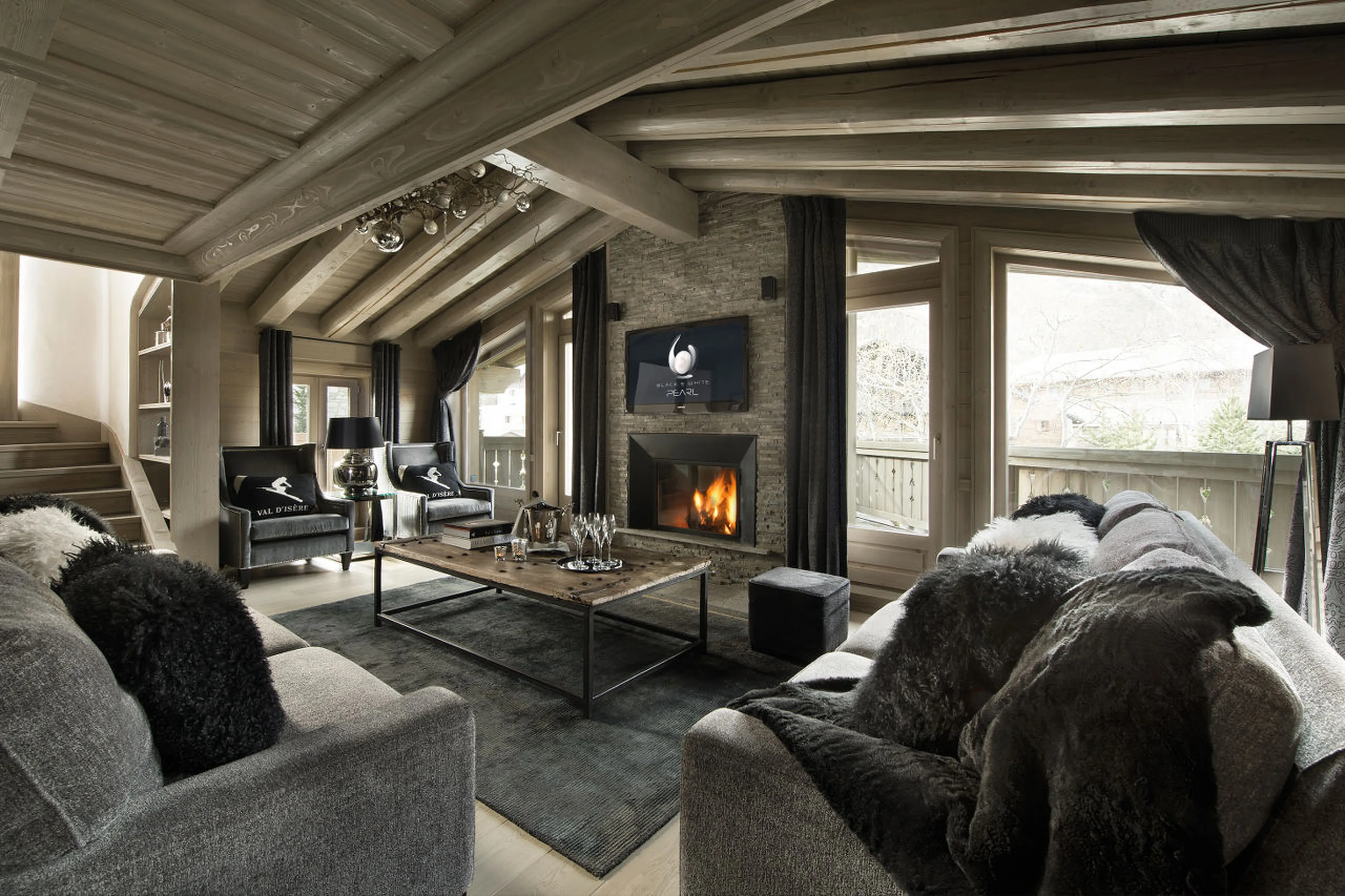 Lounge area with terrace access in Chalet Black Pearl in Val d’Isere