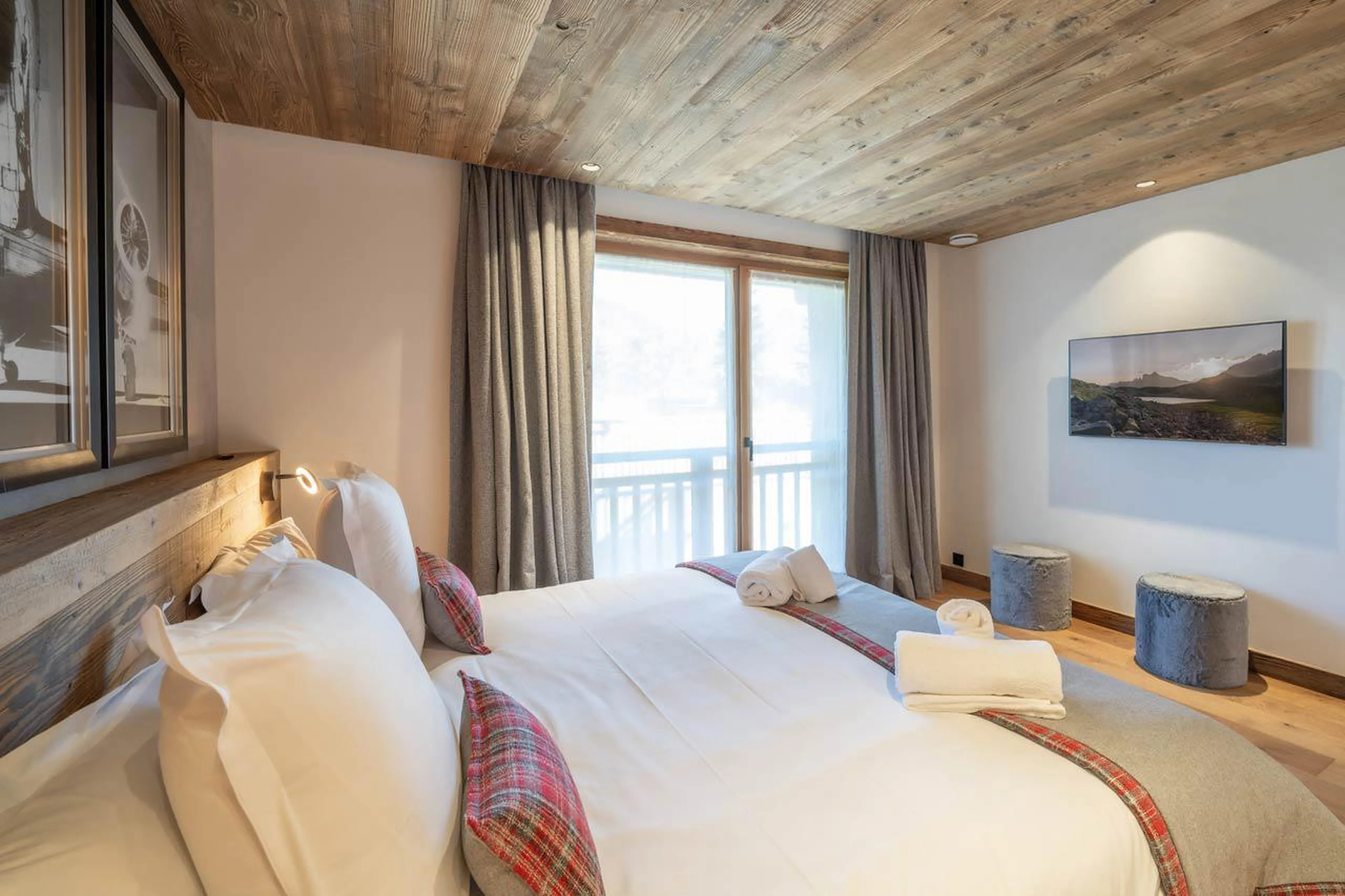 Bedroom one at Chalet Bois de l'Abbaye in Courchevel Le Praz