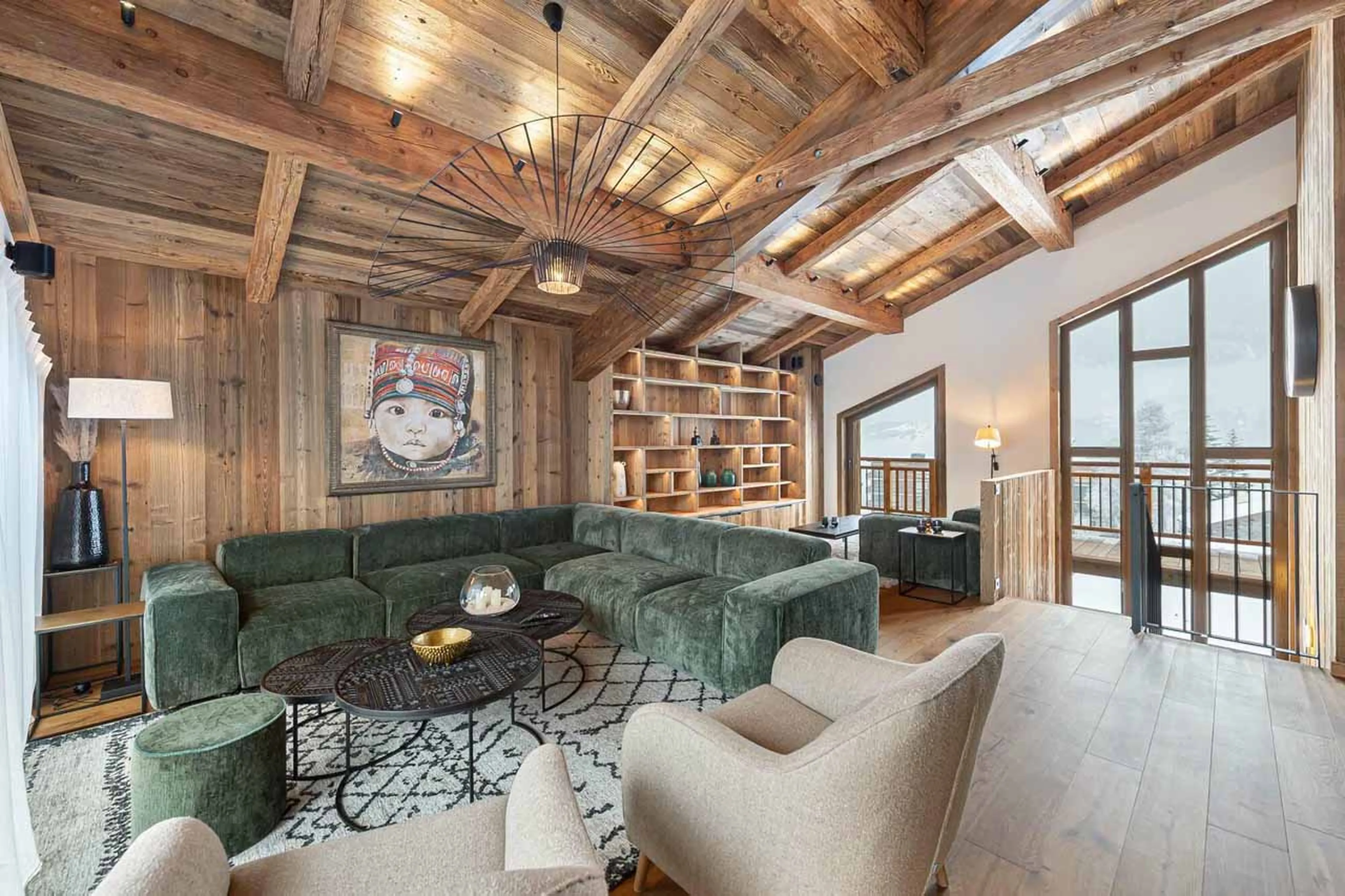 Living area opening onto terrace at Chalet Bois du Ban in Courchevel Le Praz