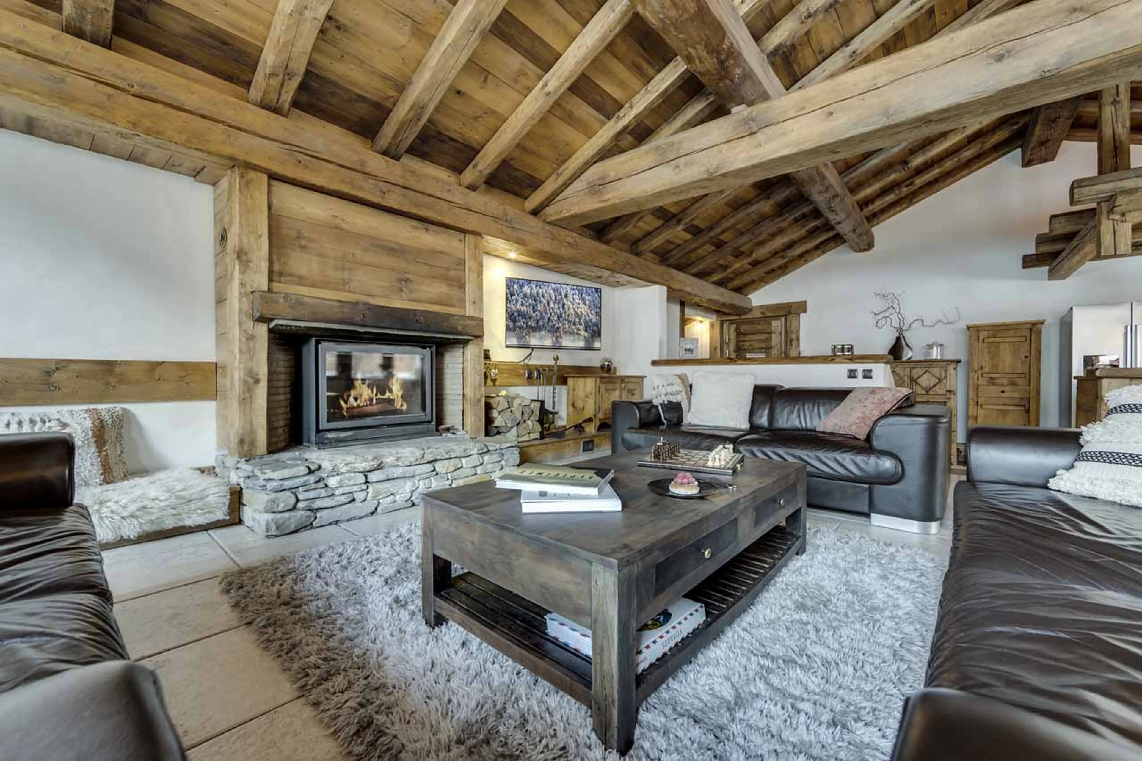 Sofas and fireplace at Chalet La Bouclia in Val d'Isere