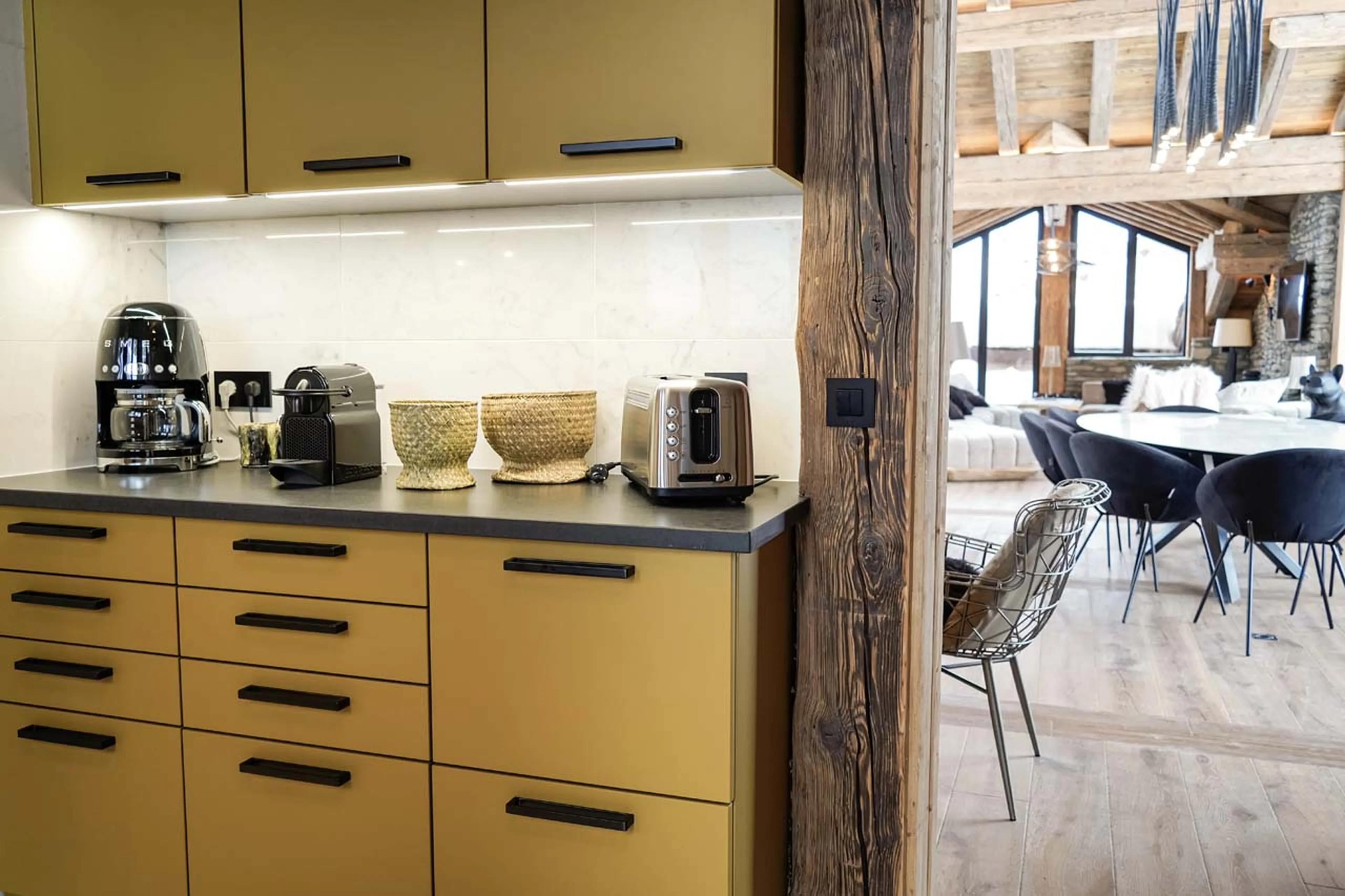 Kitchen flowing into living area in Chalet Cahokia, Val d'Isere