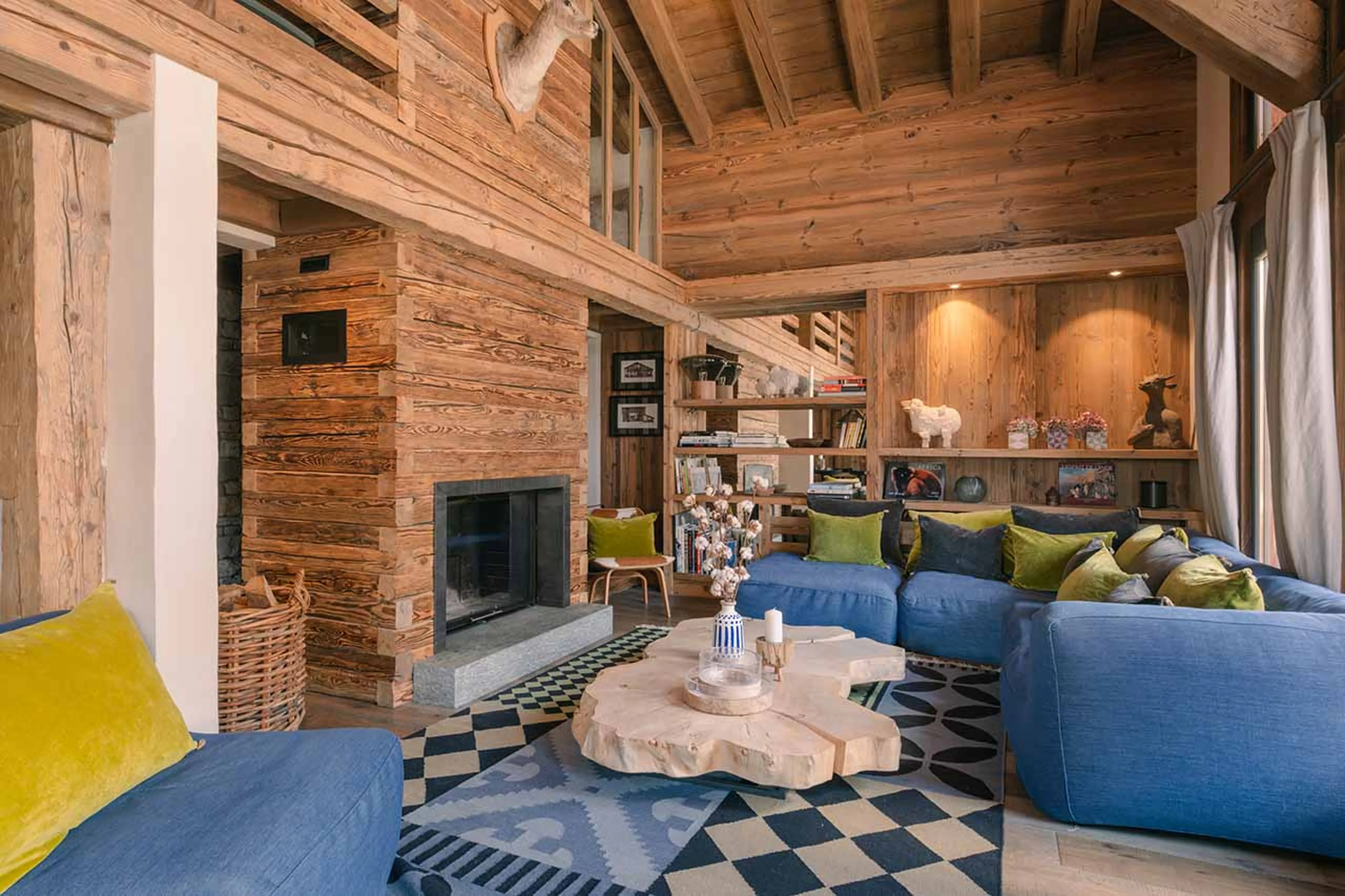 Cosy living area with fireplace at Chalet Calistoga in Val d'Isere