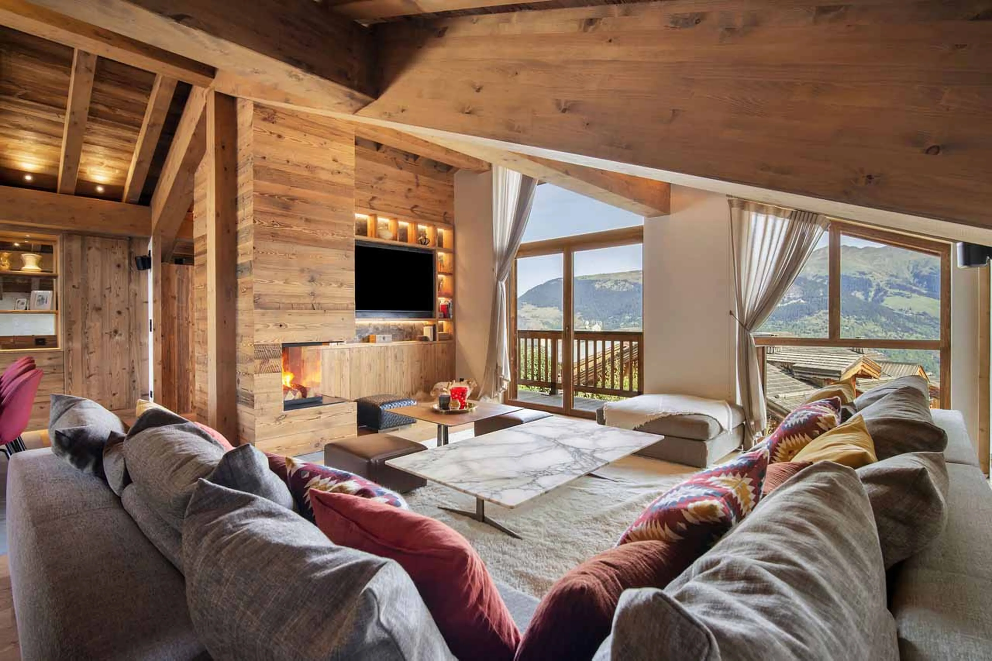 Open plan living area at Chalet Carcentina in Courchevel 1550