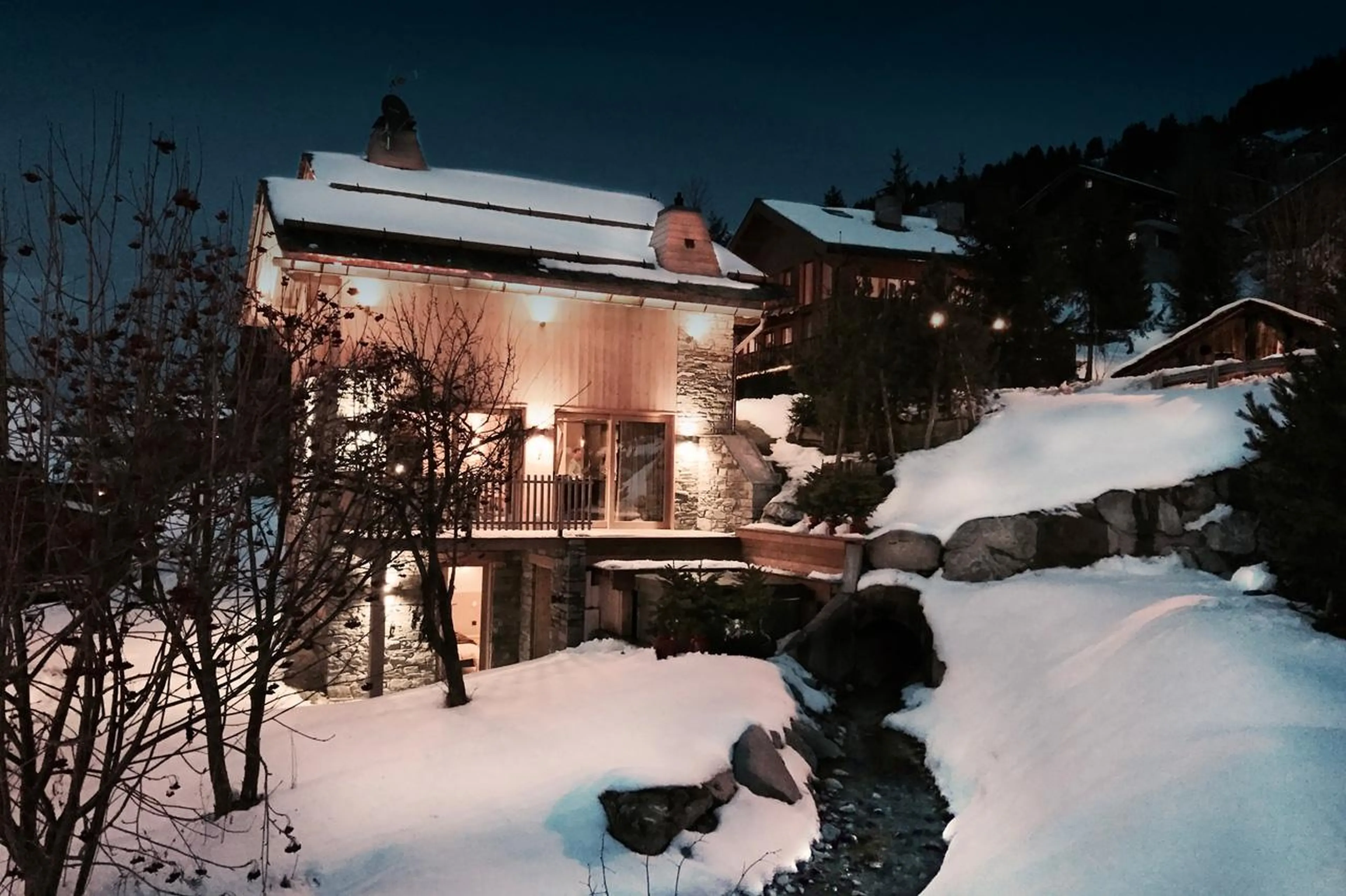 Side view of exterior of Chalet Caro, Meribel at night