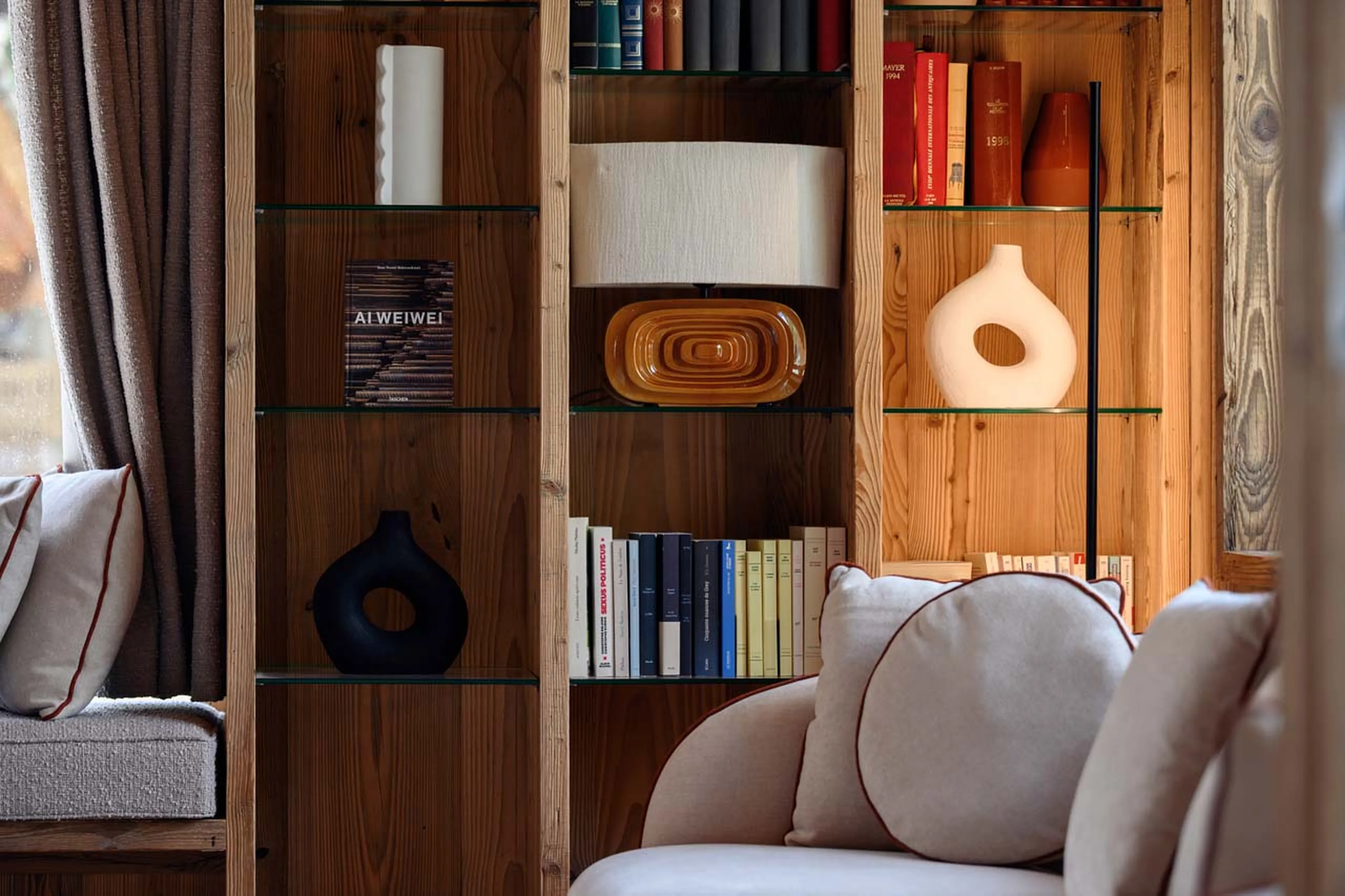 Bookcase in living area at Chalet Cervinia in Val d'Isere