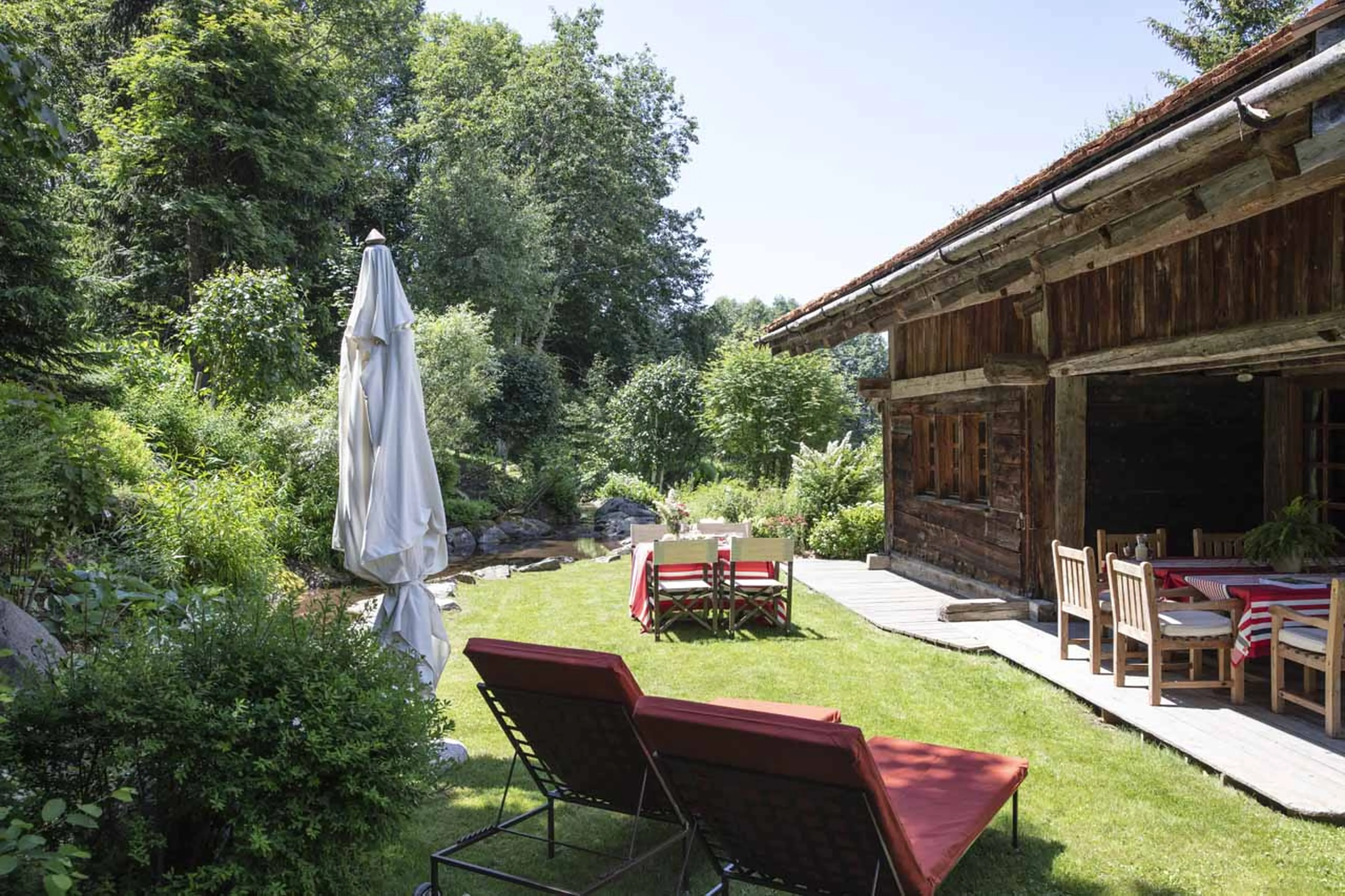 Sun loungers and garden at  Chalet Chatel in Megeve