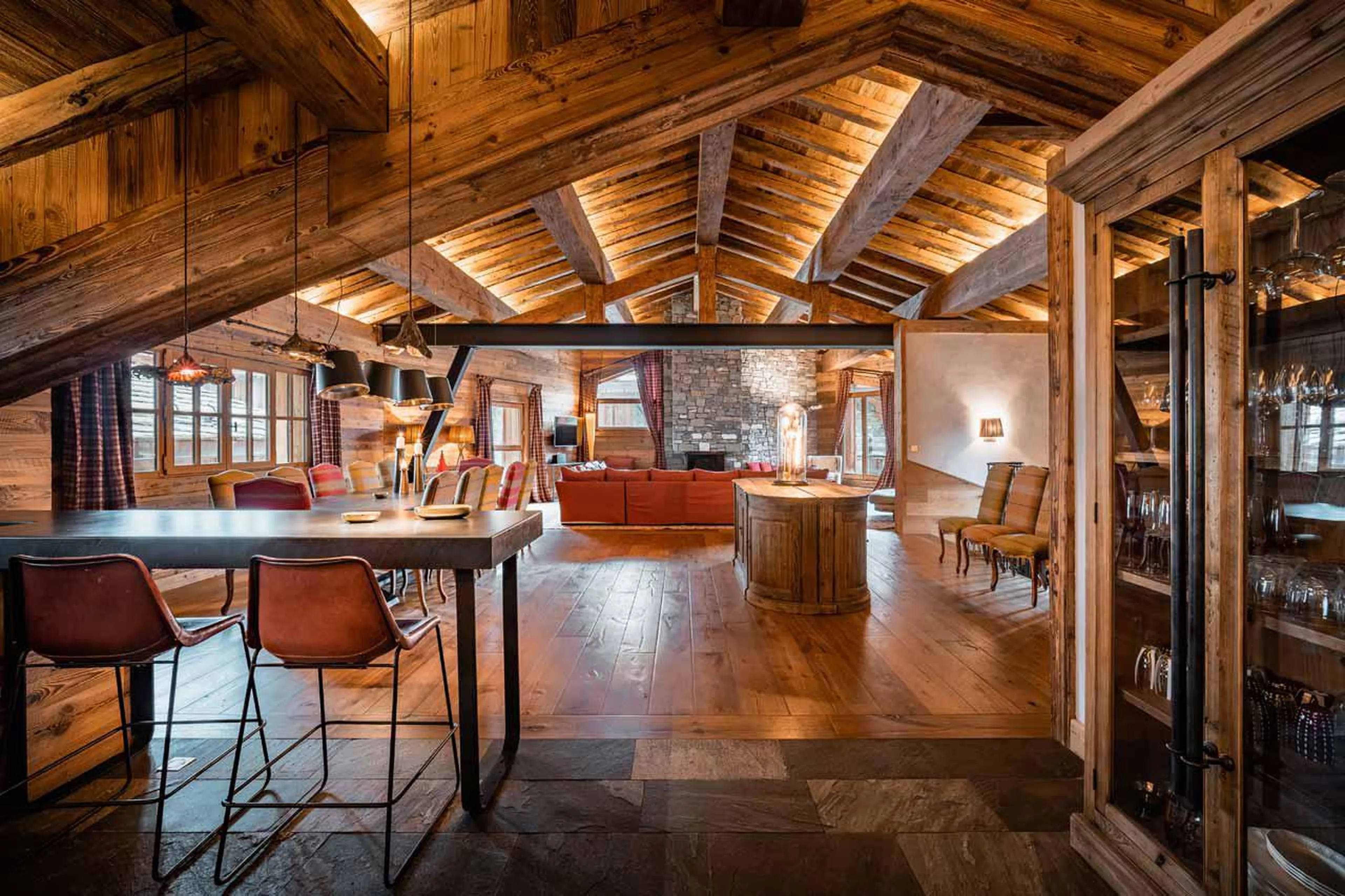Open-plan living area seen from kitchen in Chalet Chene in Val d’ Isere