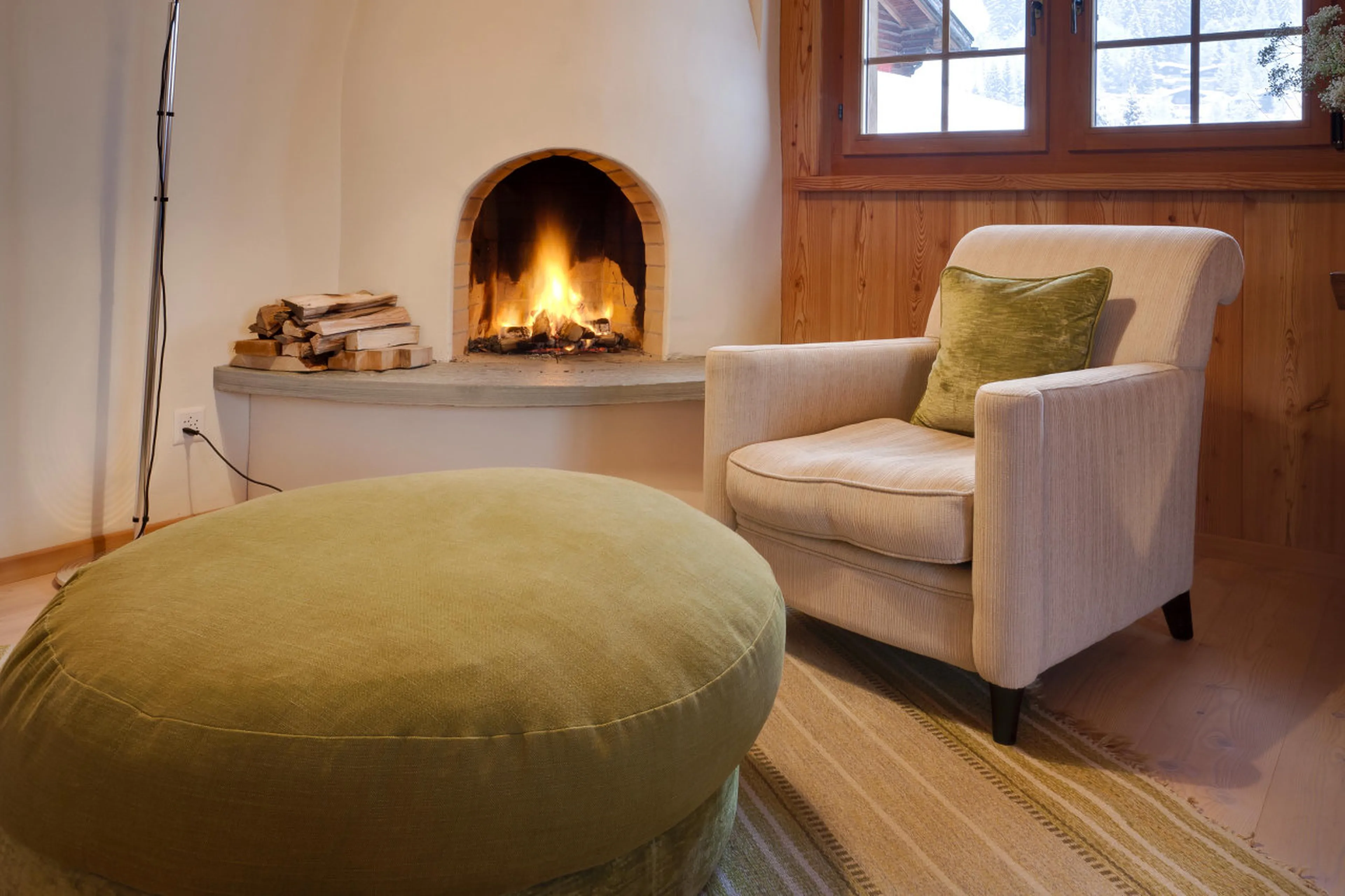 Fireplace in master bedroom in Chalet Chimera in Klosters
