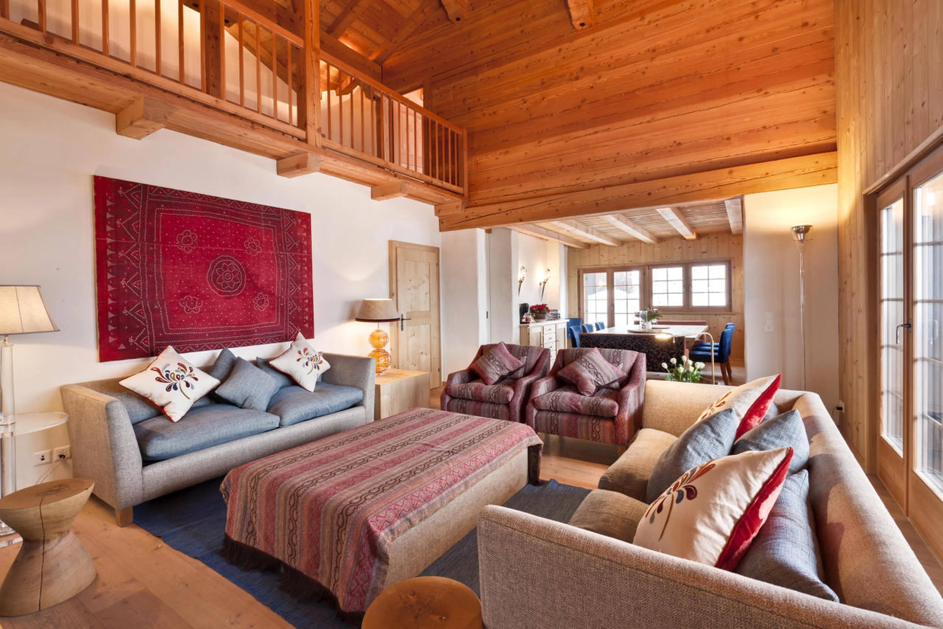 Living area with adjacent dining room in Chalet Chimera in Klosters