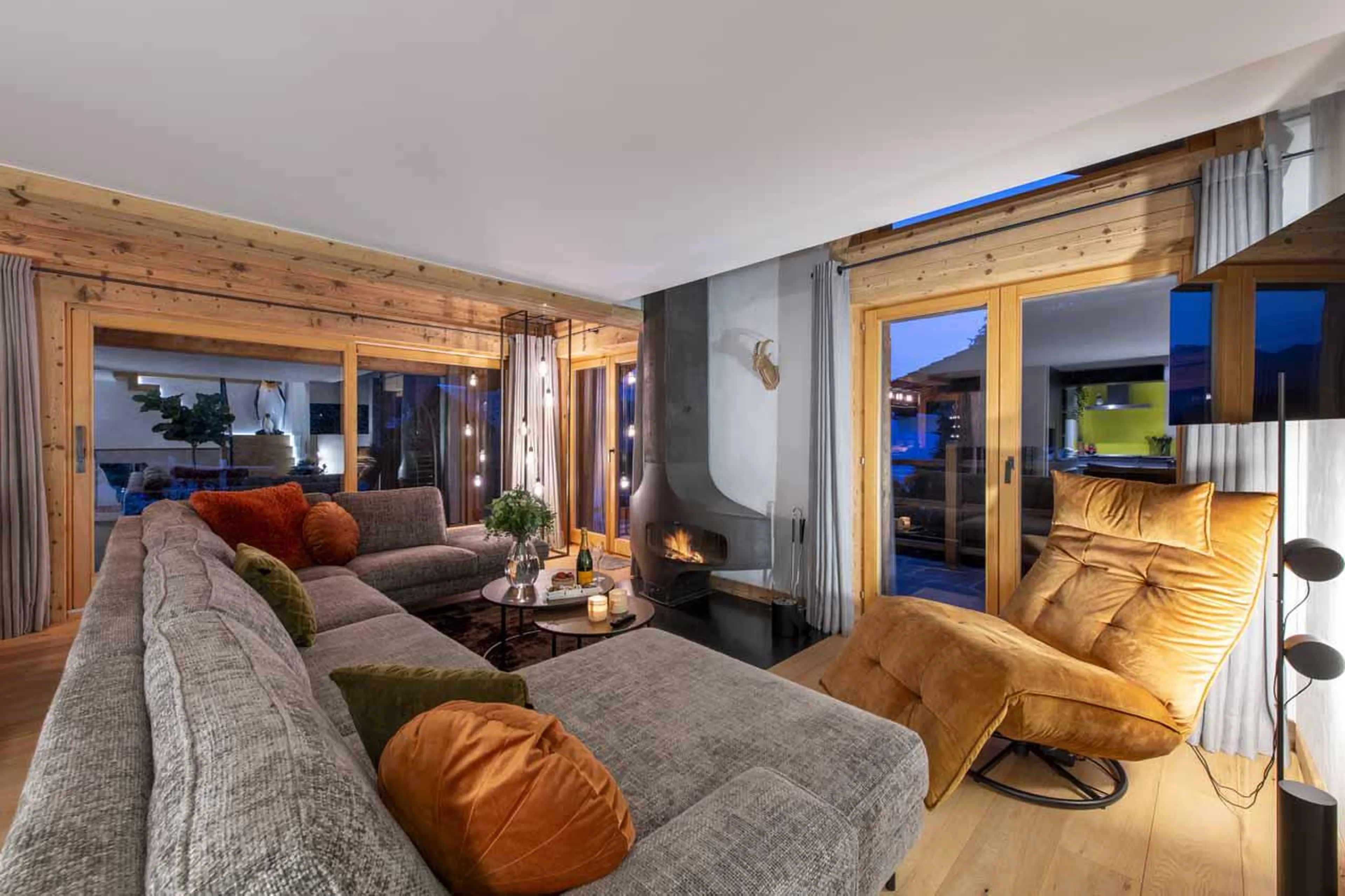 Sofas and fireplace at Chalet Clambinet in Verbier
