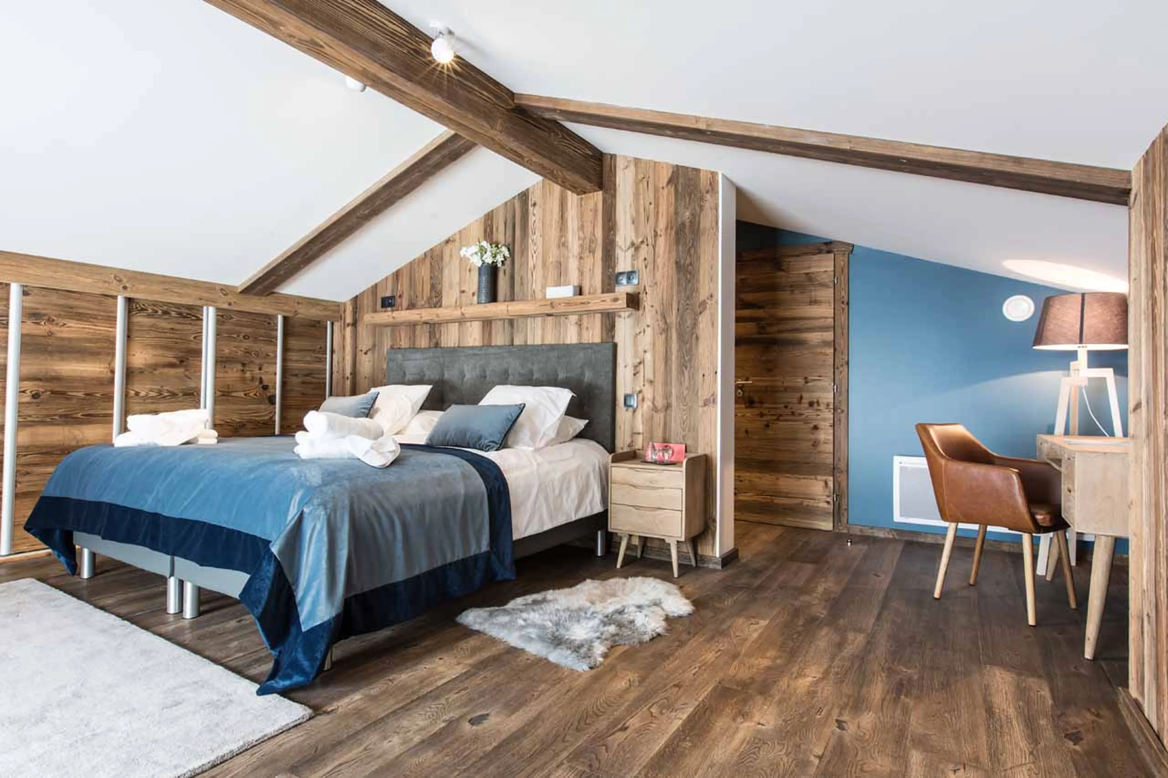 King-size bed in bedroom one at Chalet Clos Saint Jean in Les Gets