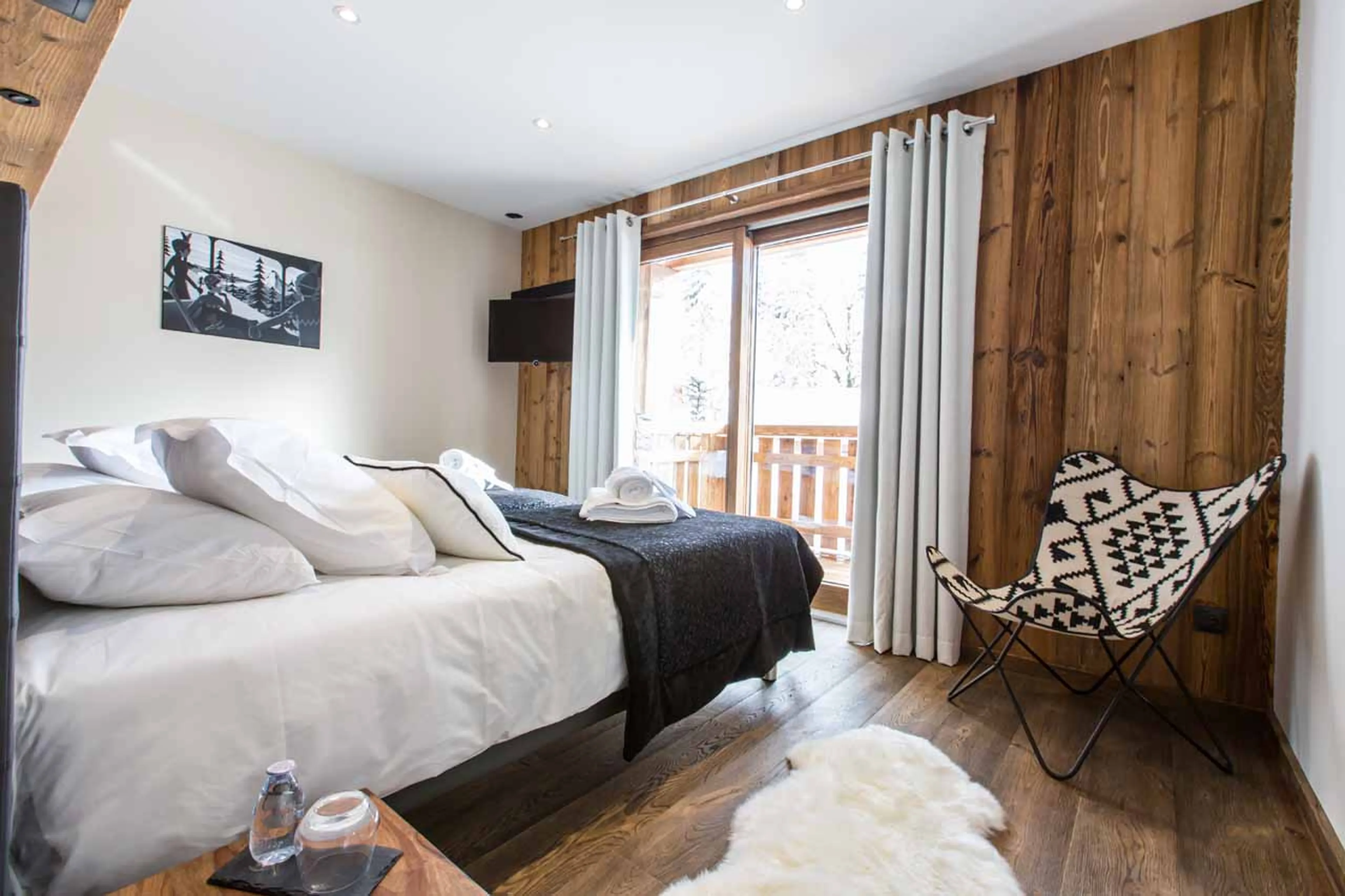 Balcony access from bedroom six at Chalet Clos Saint Jean in Les Gets