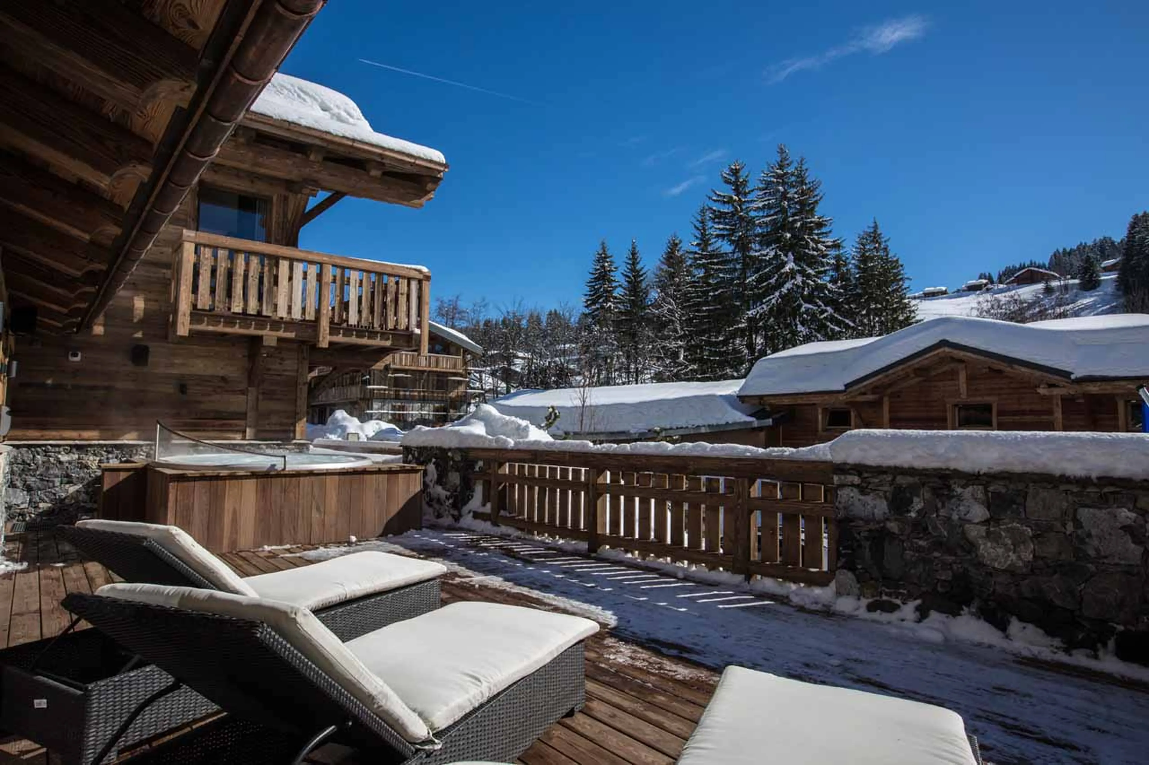 Terrace with hot tub at Chalet Clos Saint Jean in Les Gets
