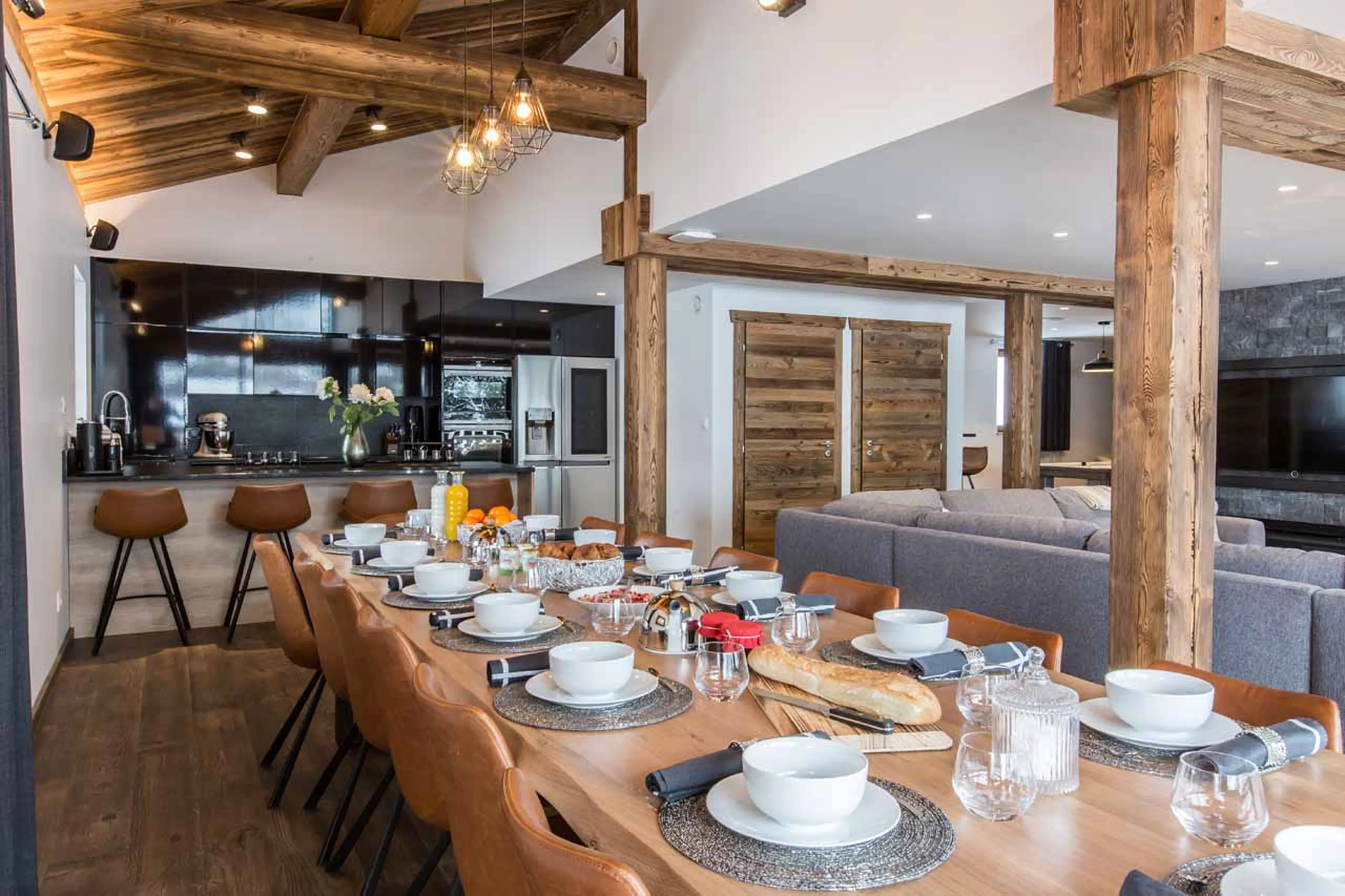 Dining table and kitchen at Chalet Clos Saint Jean in Les Gets