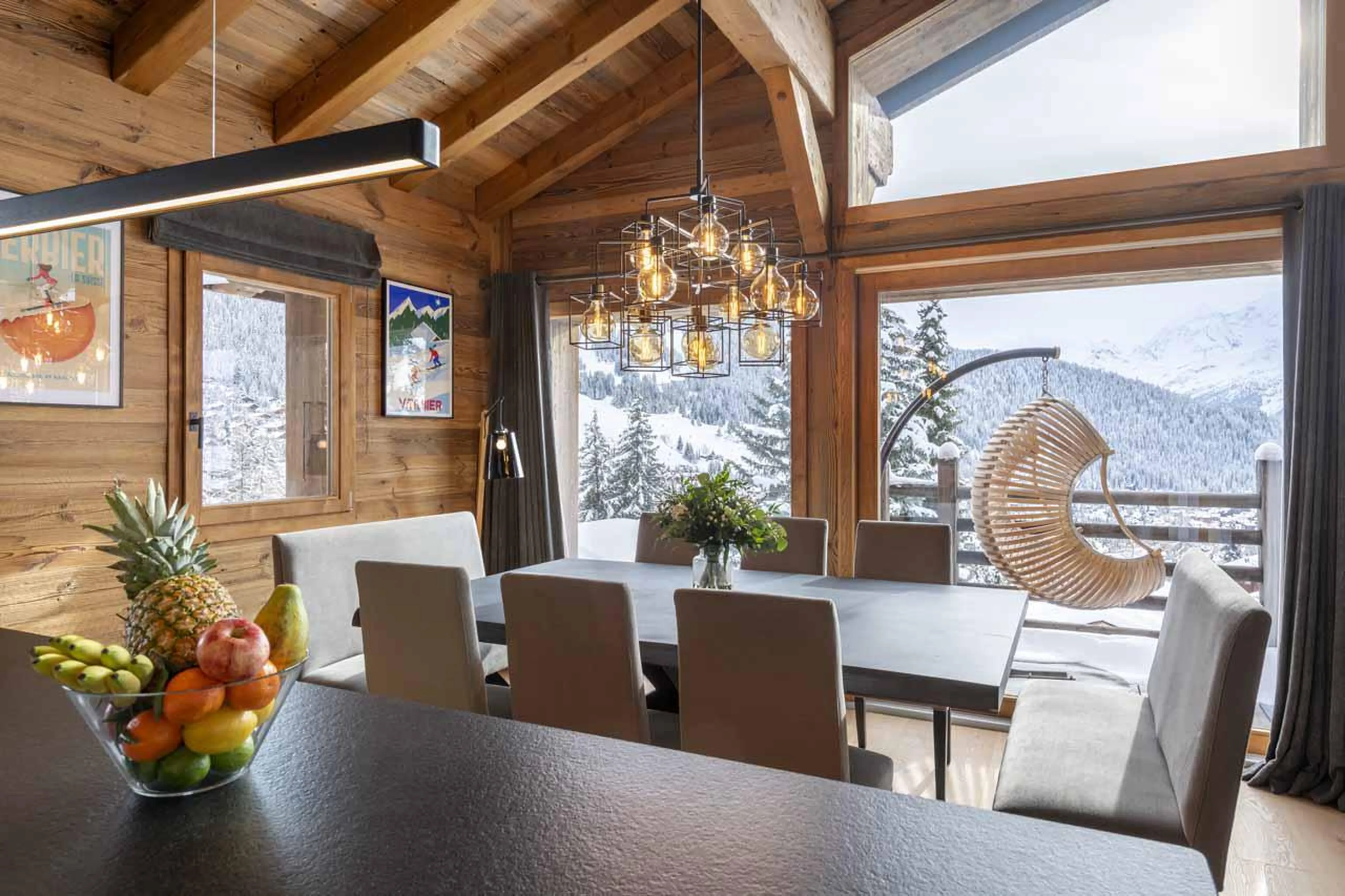 Dining area flooded with natural light at Chalet Cortil in Verbier