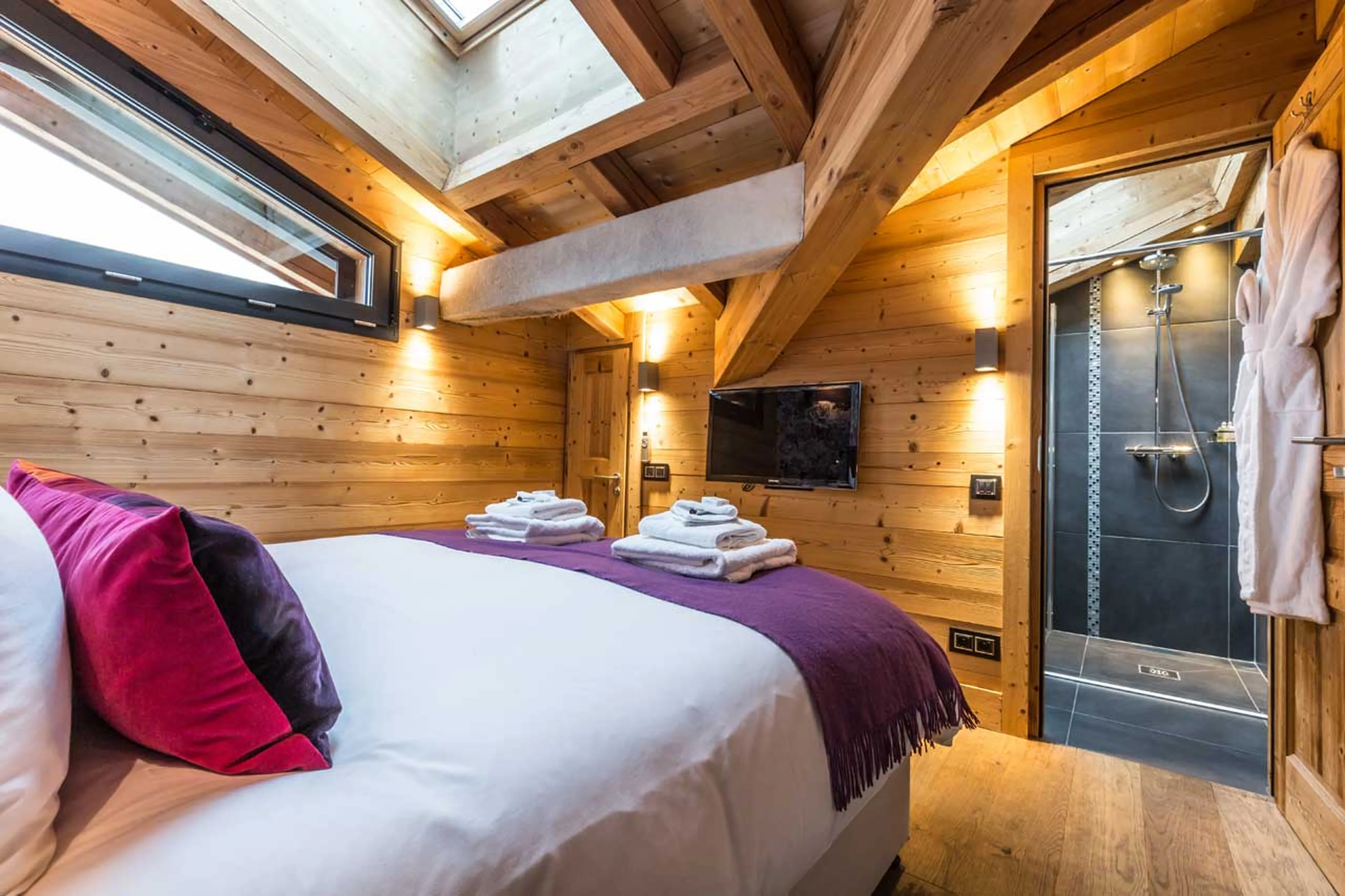 King-size bed and en-suite shower room in Butterfly, Chalet Couttet in Chamonix