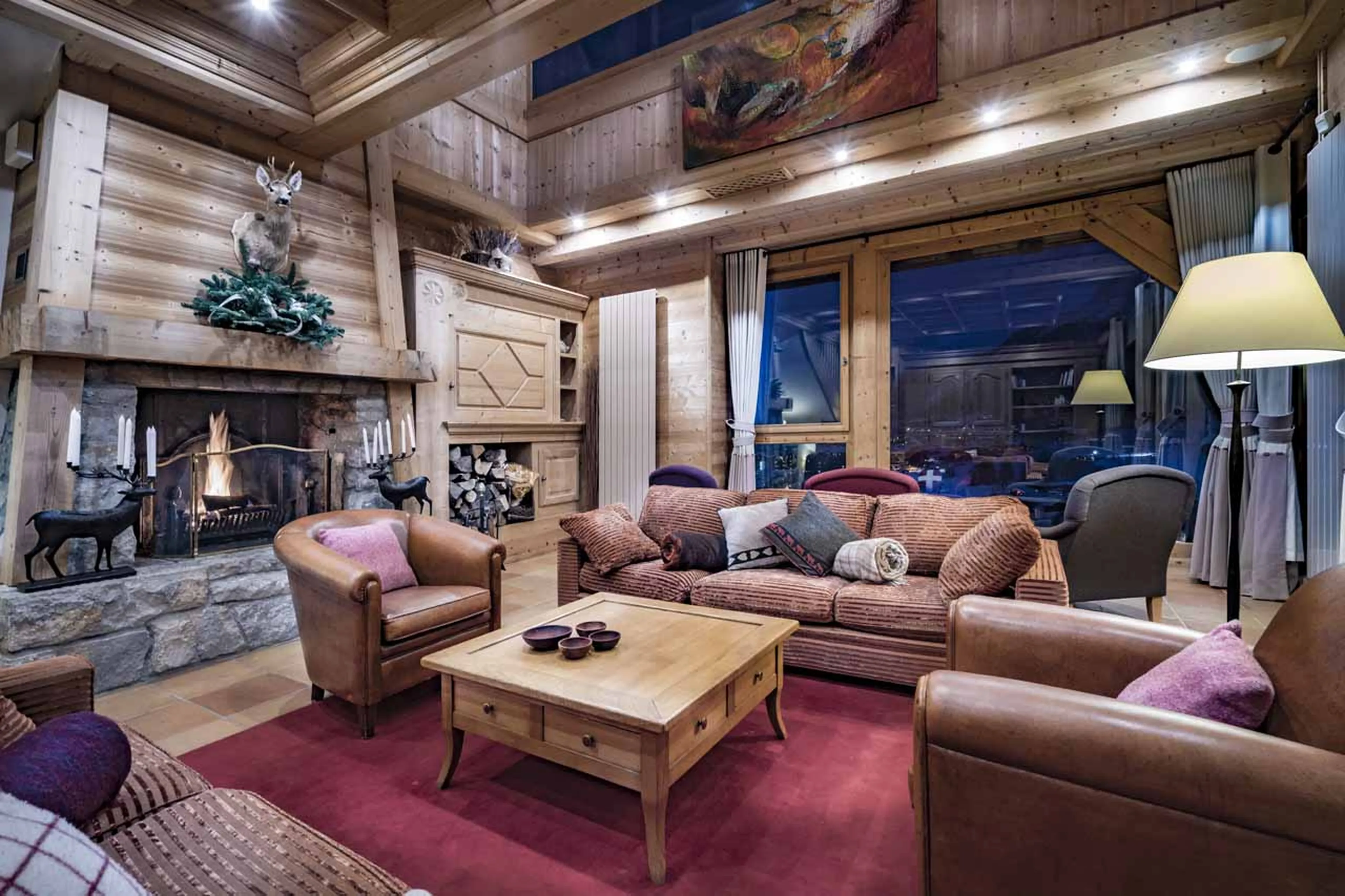 Open fireplace in living area of Chalet Cristal A in Val d’Isere
