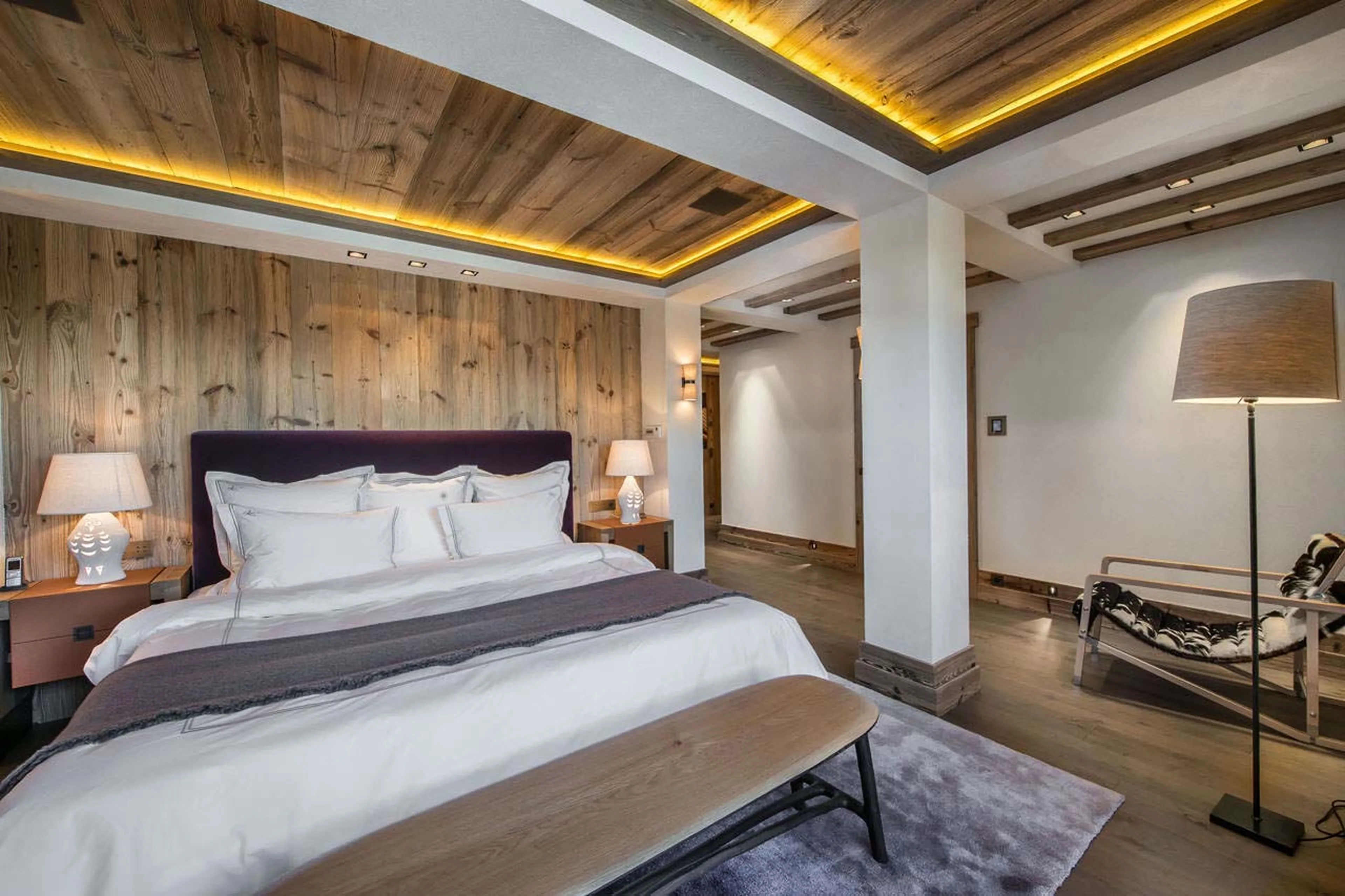 Master bedroom with a king-size bed in Chalet Cryst'Aile in Courchevel 1850