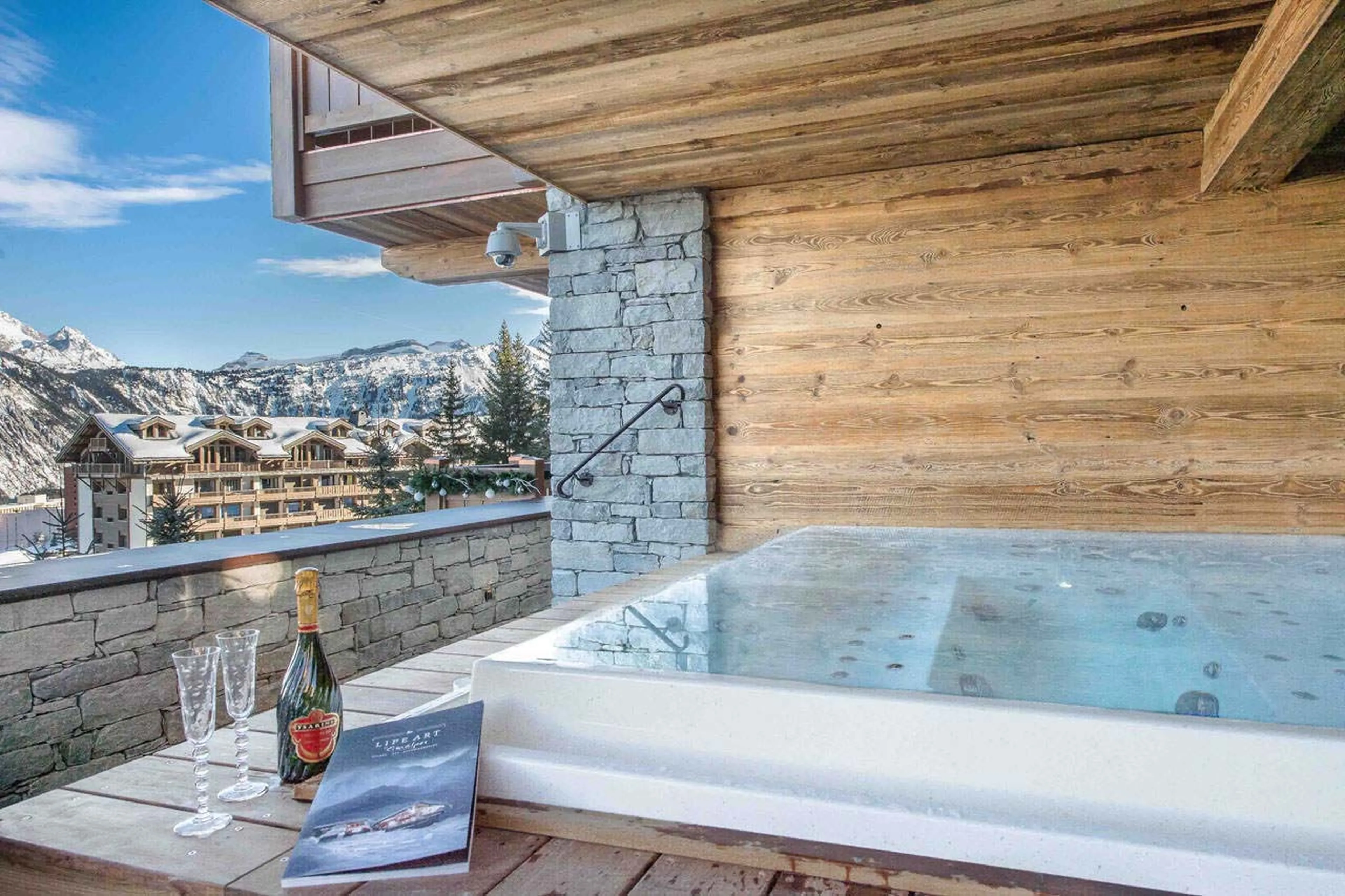 Outdoor Jacuzzi with a lovely view in Chalet Cryst'Aile in Courchevel 1850