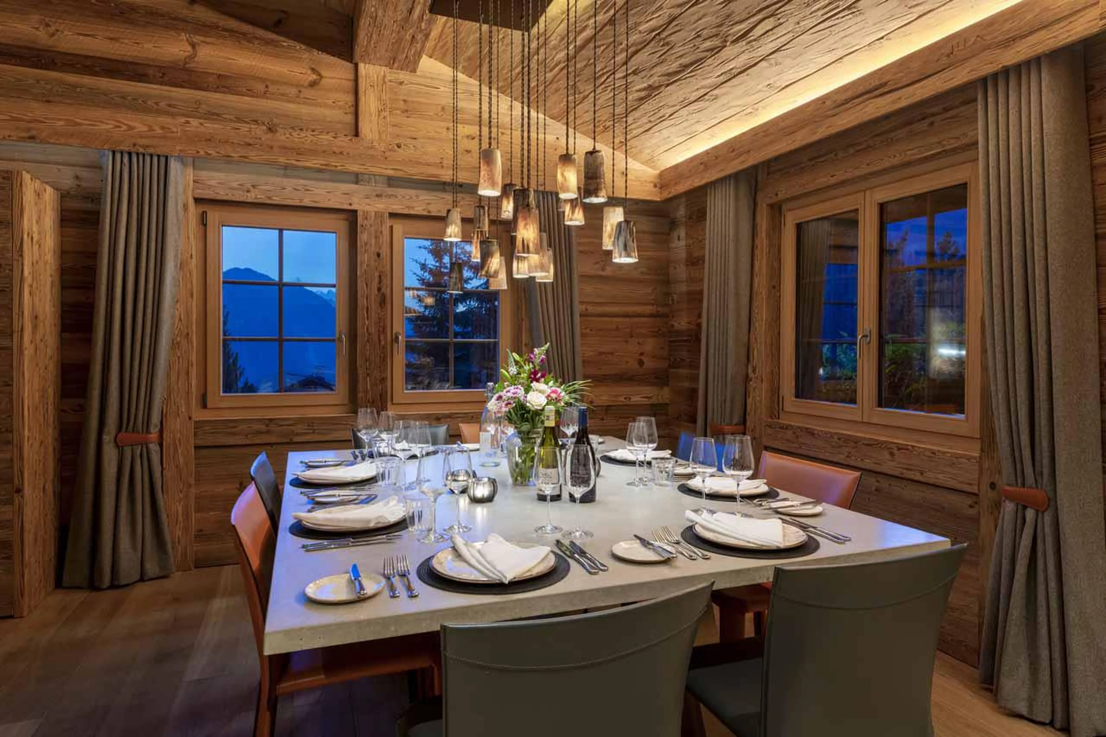 Dining table seating ten guests in Chalet Daphne in Verbier