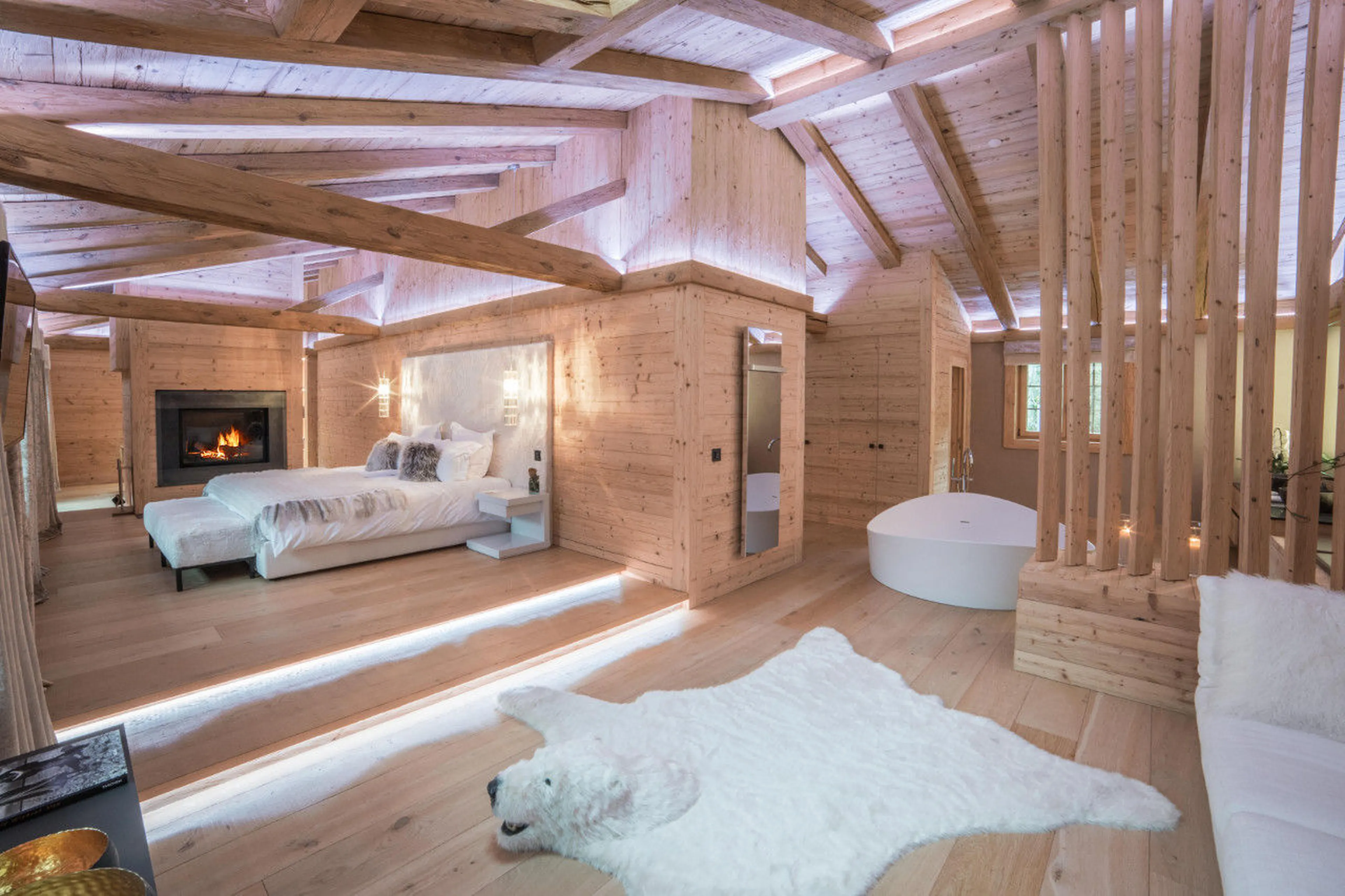 King size bed in en-suite master suite of Chalet de Rougemont in Gstaad