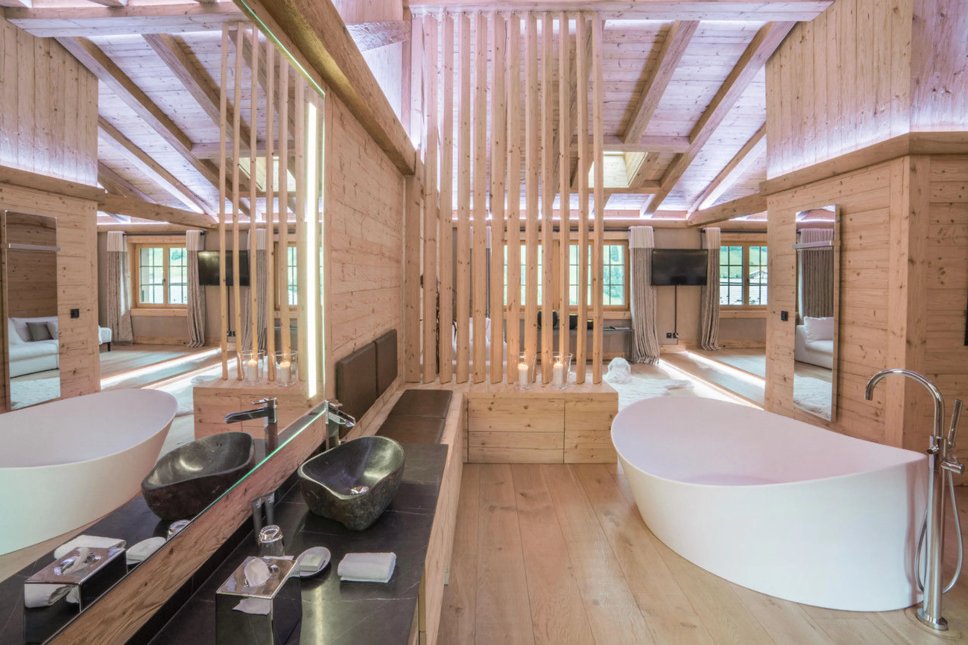 En-suite bathroom with in-room bath in Chalet de Rougemont in Gstaad