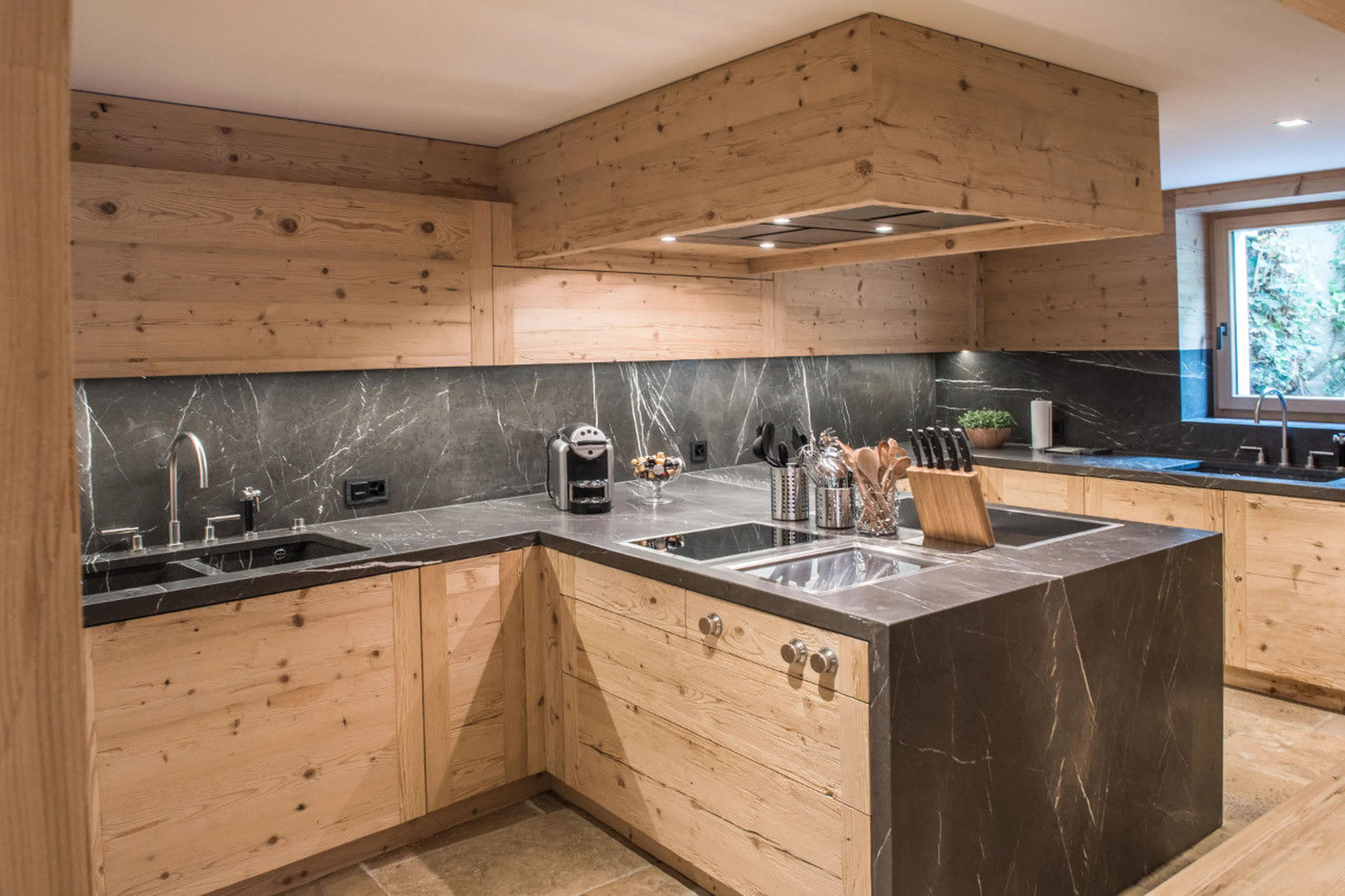 Fully equipped kitchen with modern amenities in Chalet de Rougemont in Gstaad