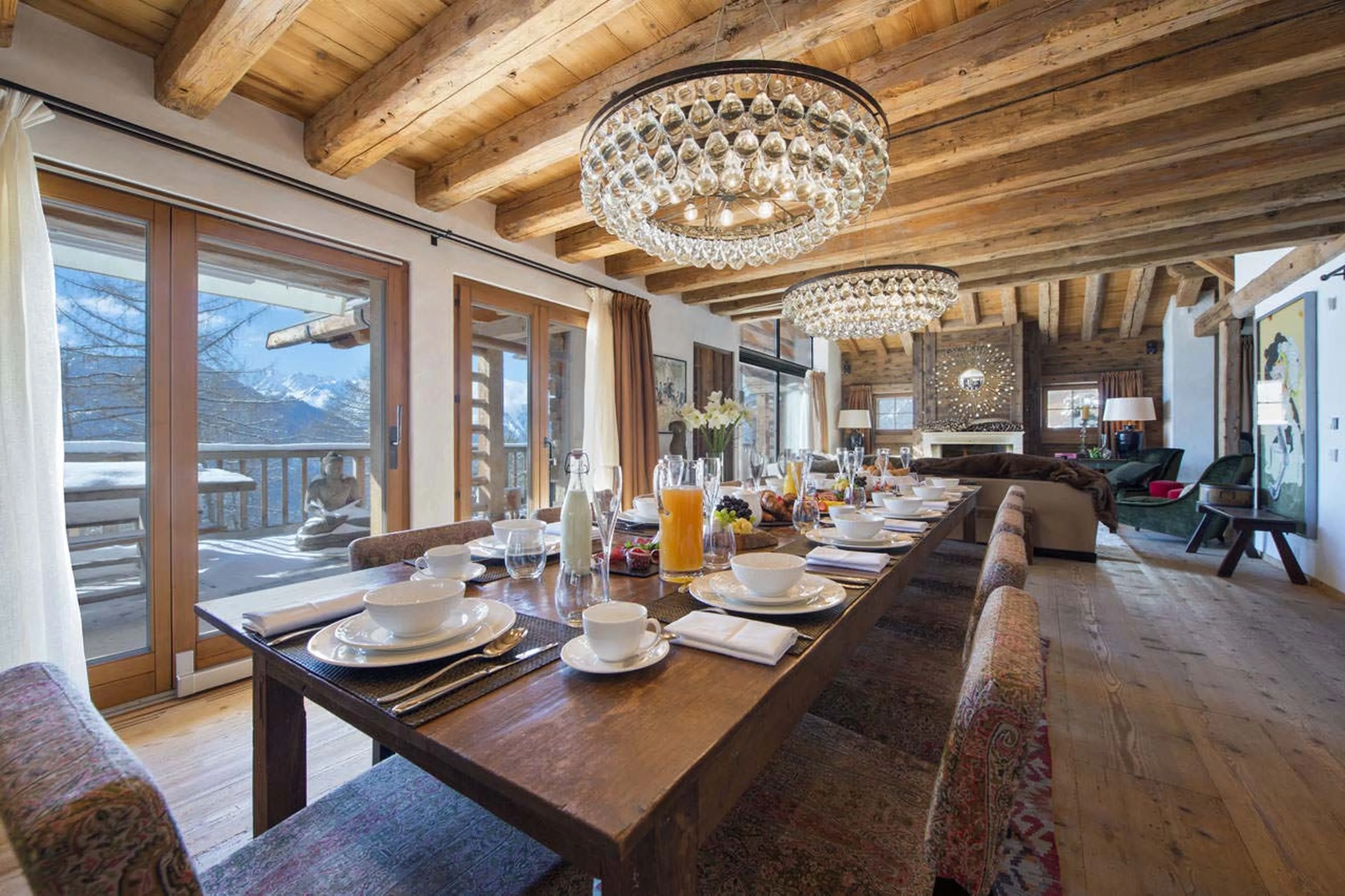 Dining room and balcony at  Chalet Dent Blanche in Verbier