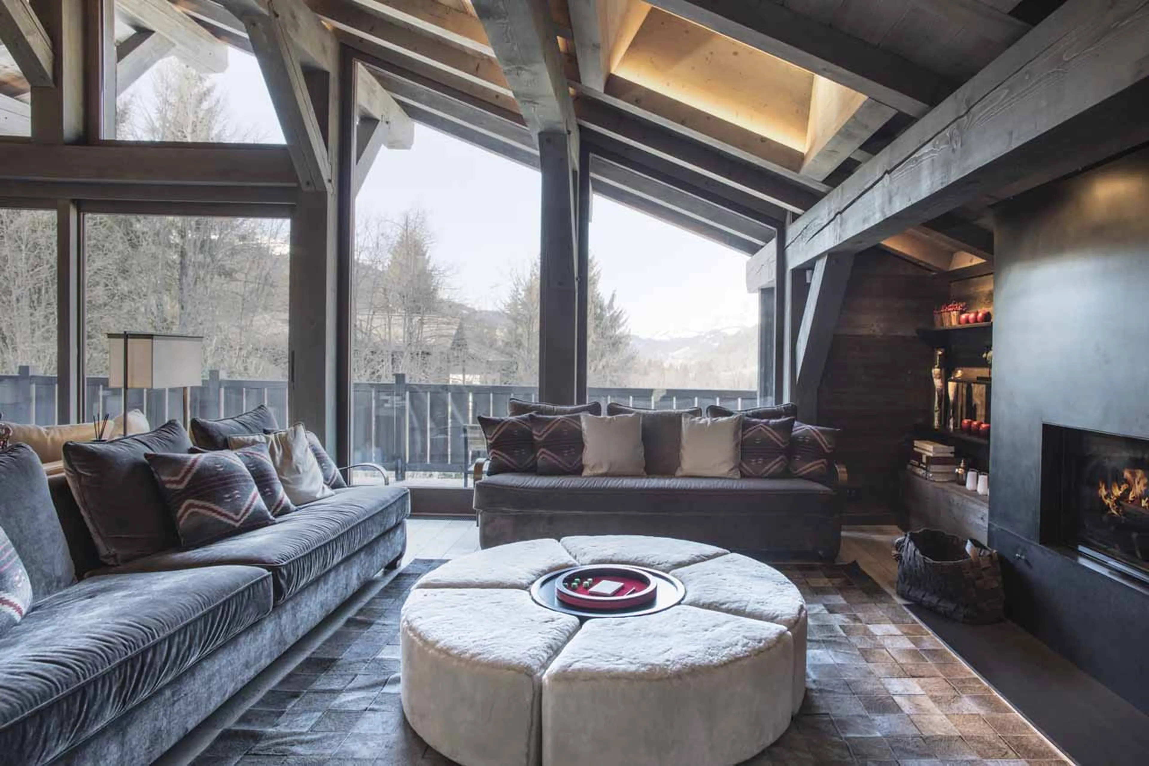 Velvet sofas in sitting room at Chalet des Ecureuils in Megeve