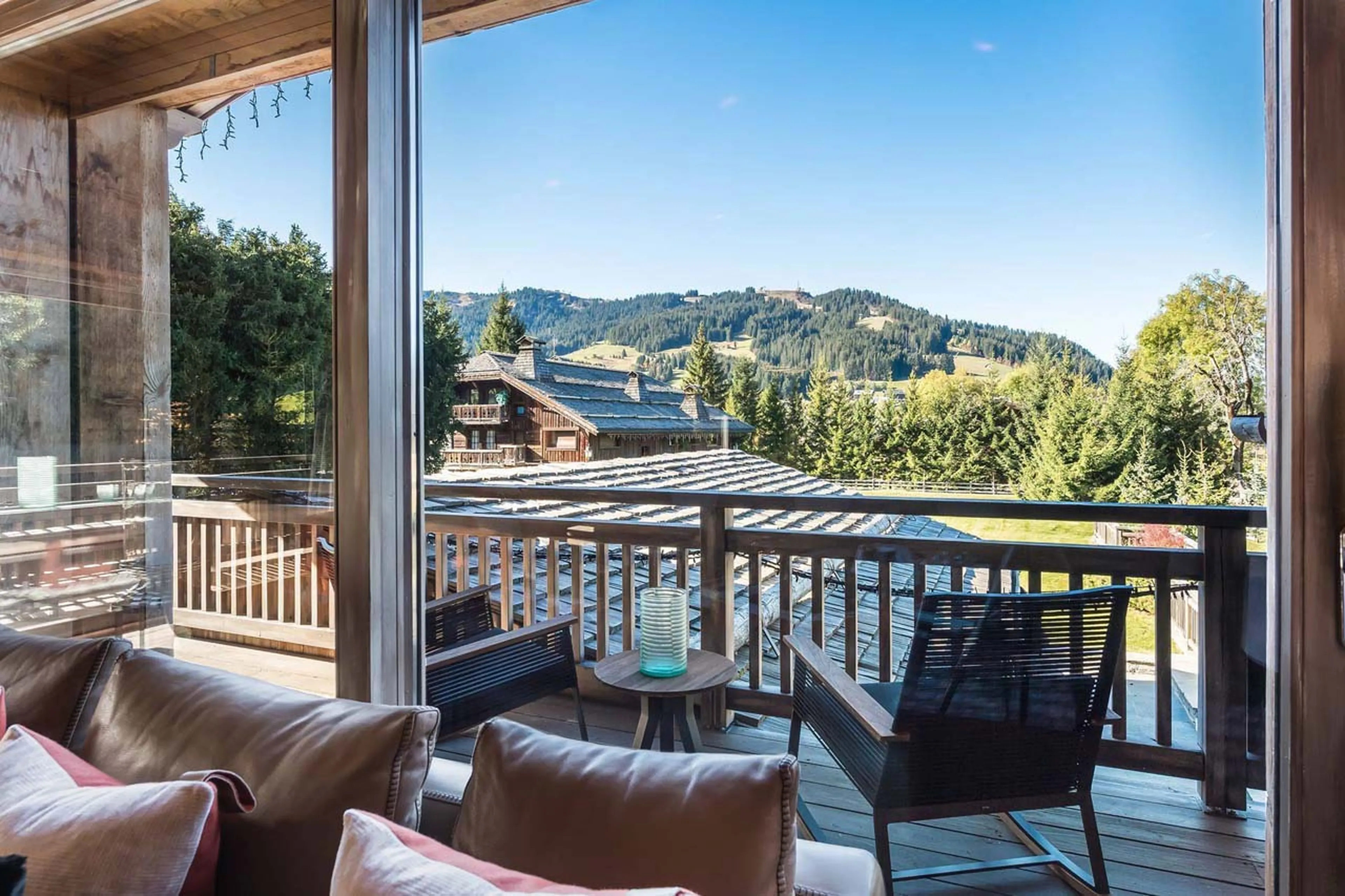 Access to balcony from living area of Chalet Des Sens in Megeve