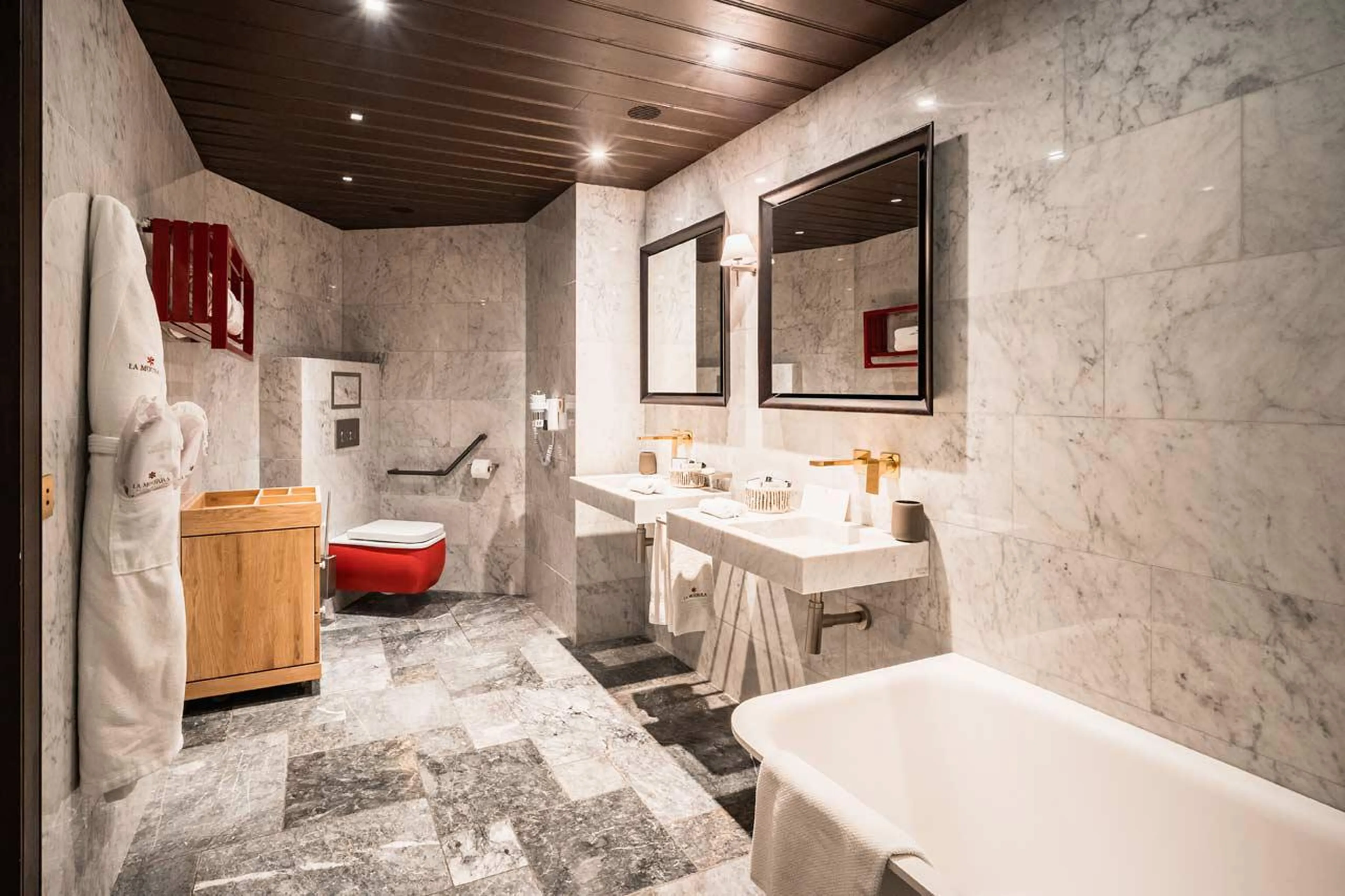 Ample lighting and large mirrors in en suite bathroom of Chalet Ebene in Val d’ Isere