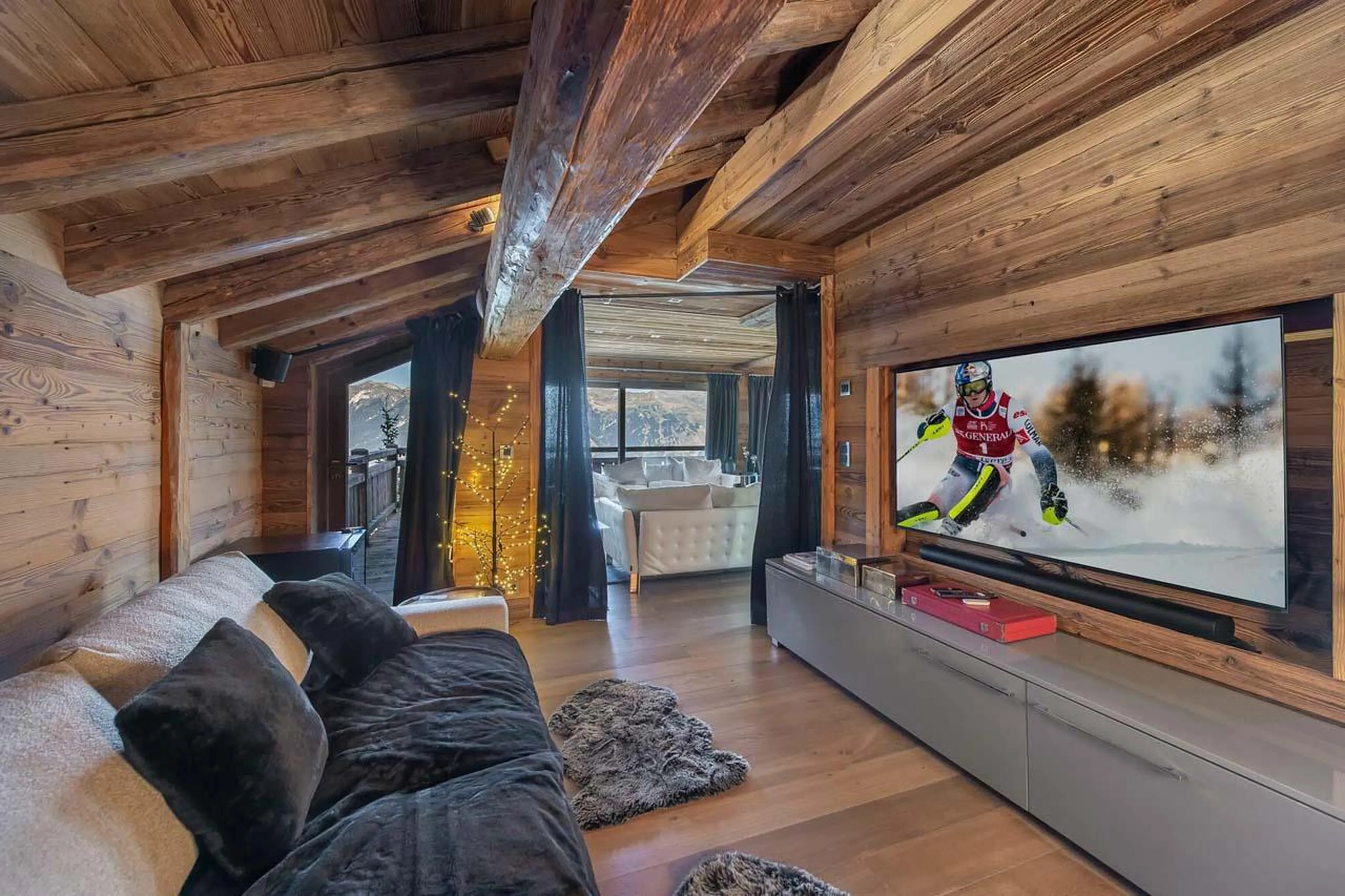 Inviting soft furnishing and 3D TV in lounge of Chalet Eden in Courchevel 1850