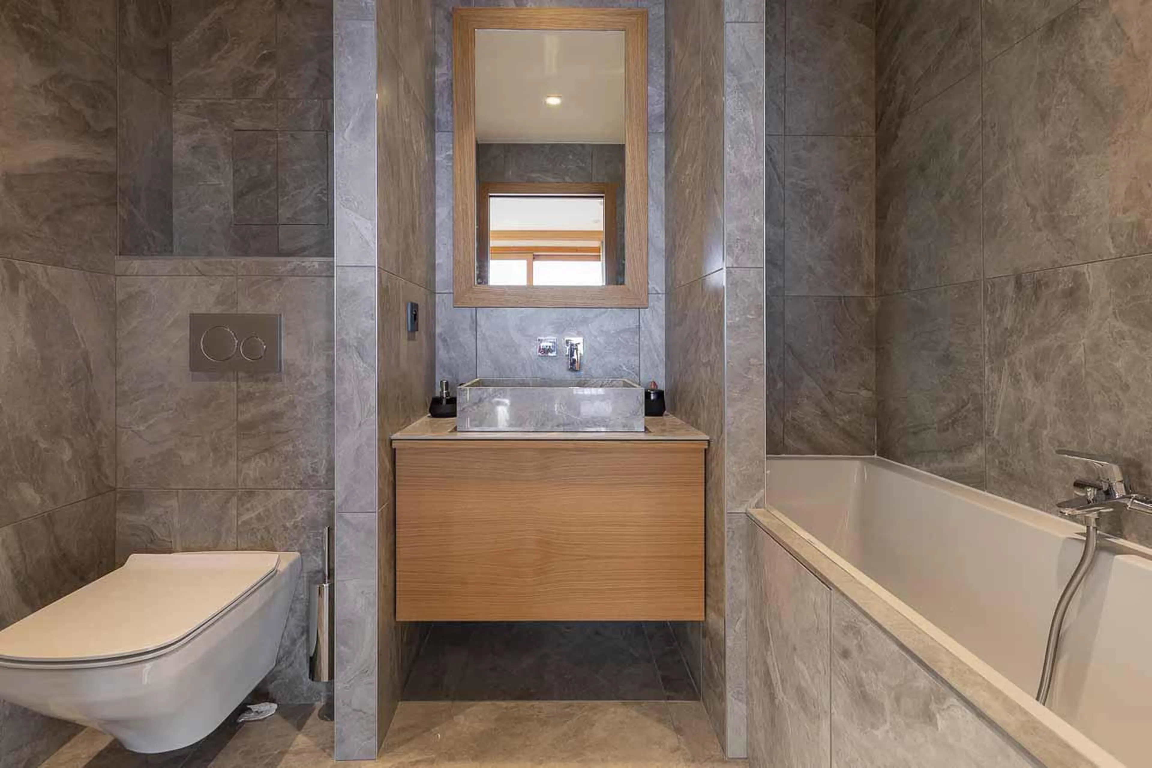 Ensuite bathroom with bathtub at Eden Mille 8 in Les Arcs