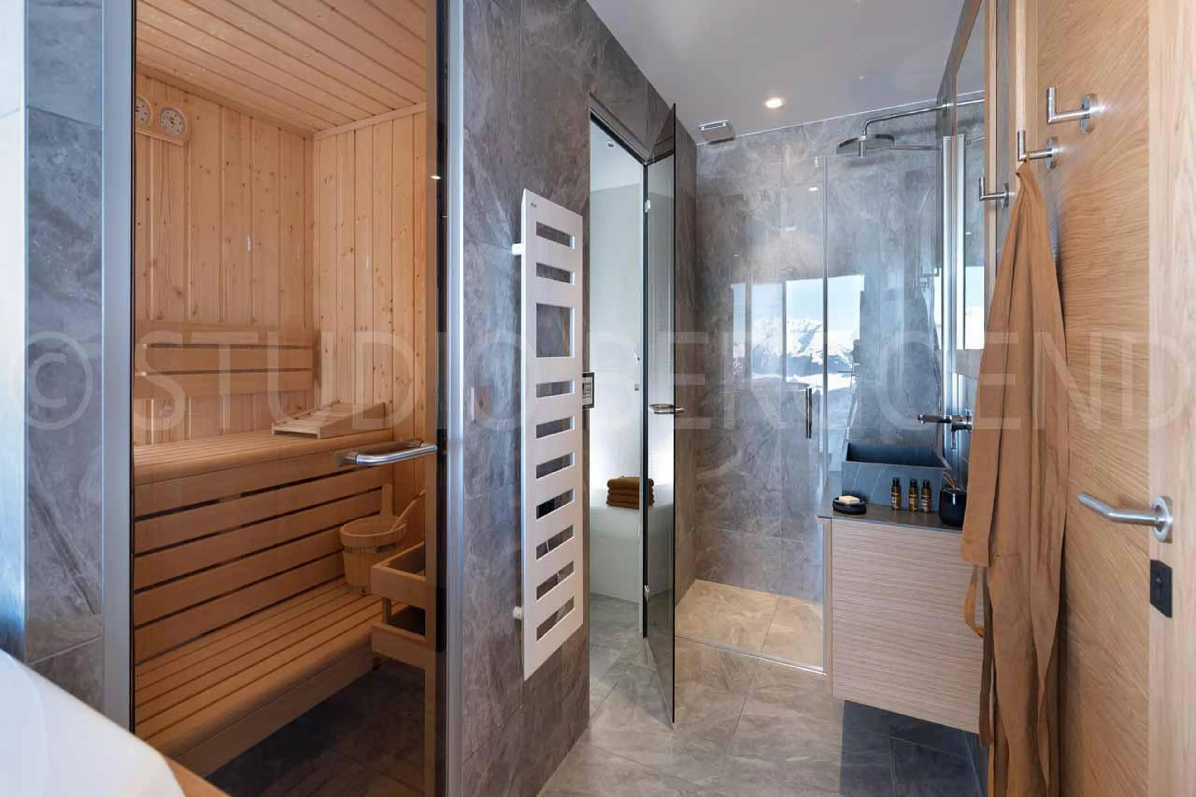 Tranquil spa area with sauna and Italian style shower at Eden Mille 8 in Les Arcs