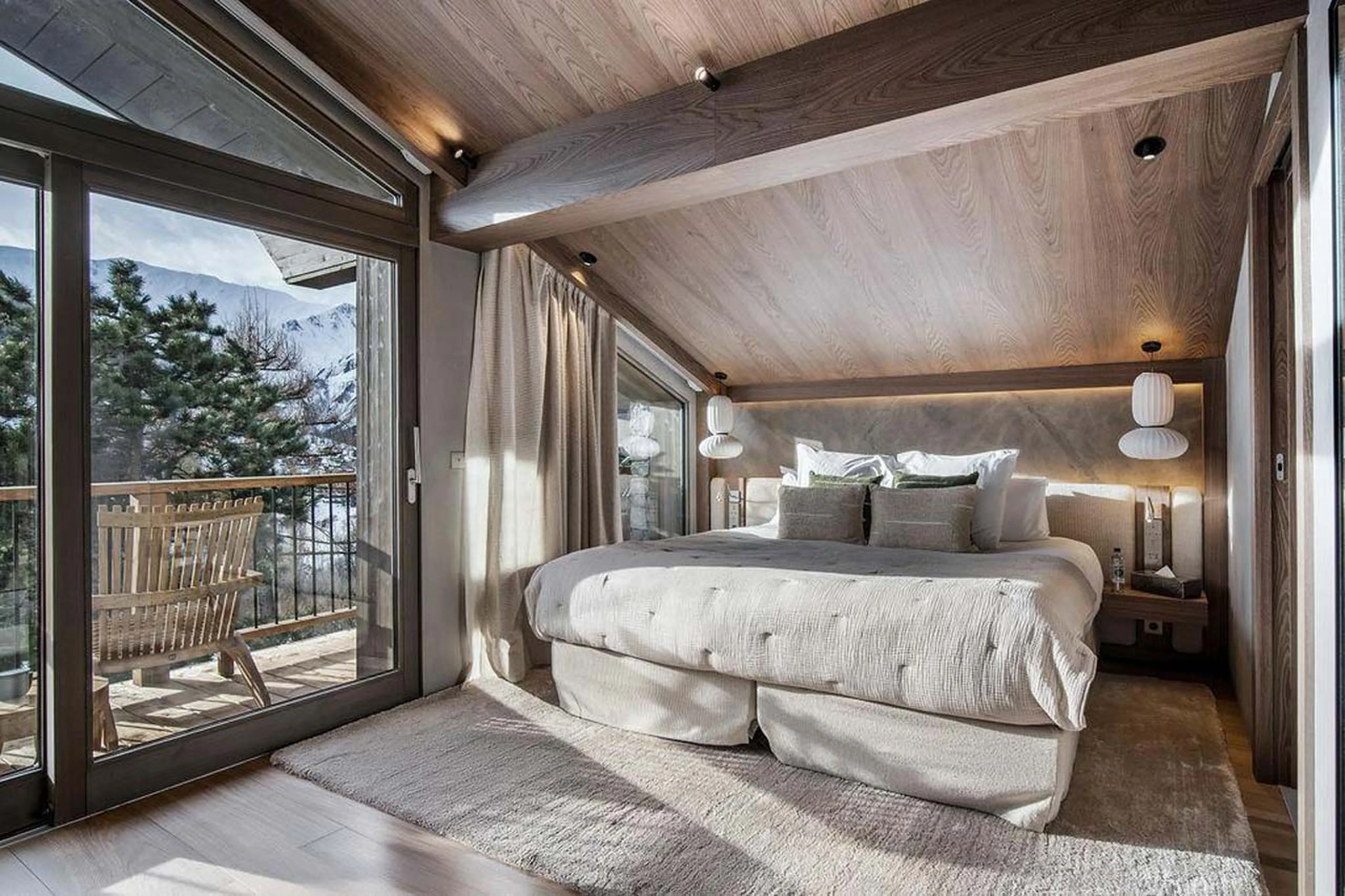 Double bedroom with glass doors in Chalet Escapade, St Martin de Belleville